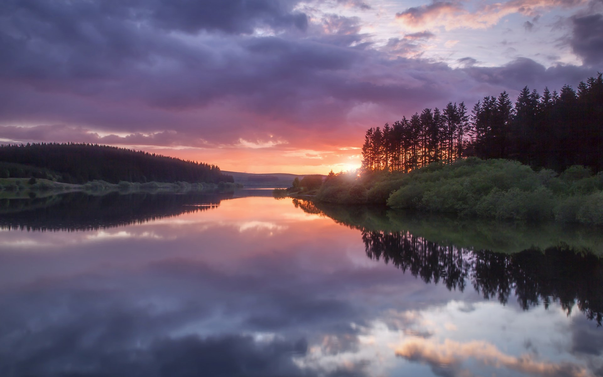 Sunset over a lake with reflections and trees HD Wallpaper