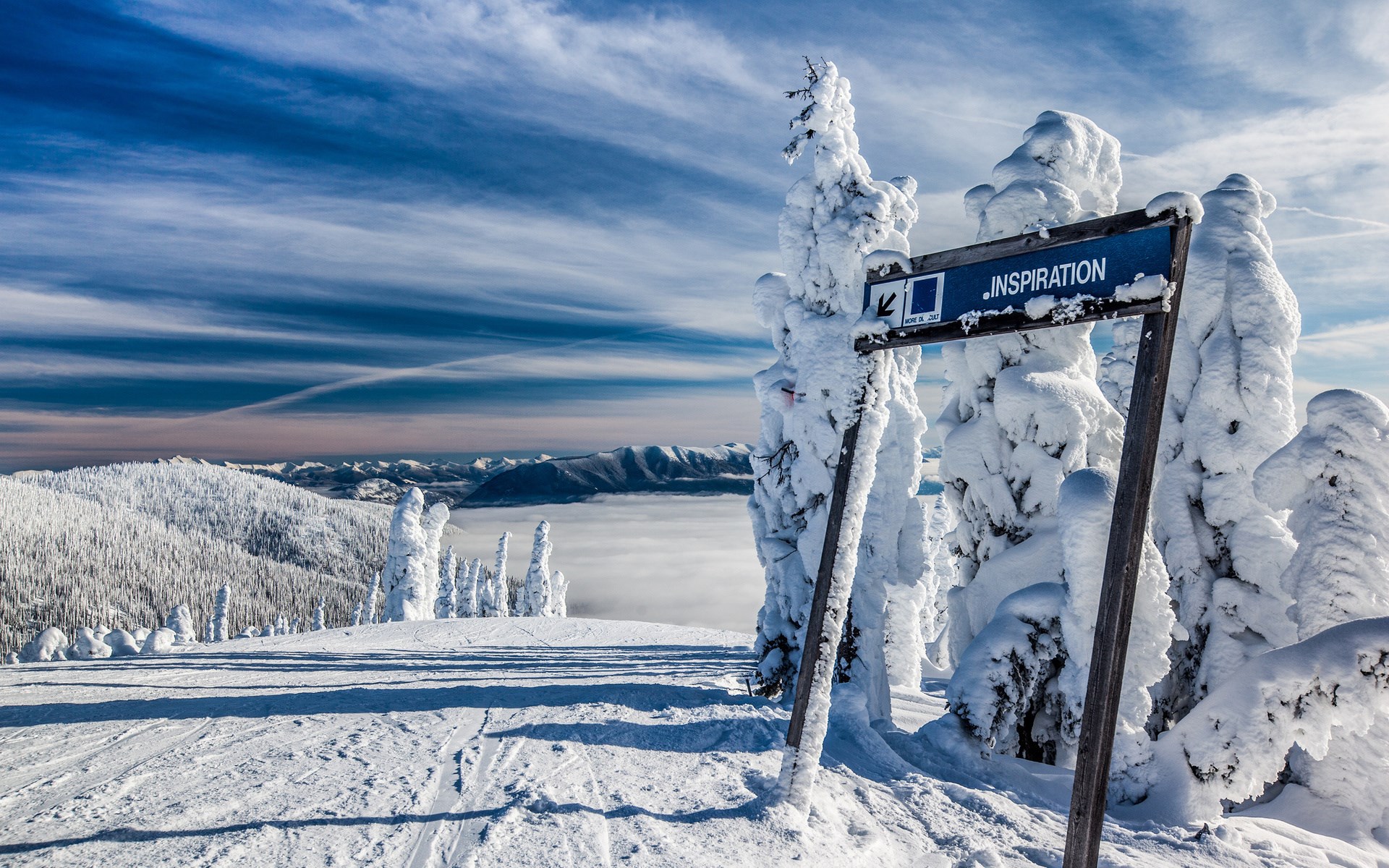 Ski slope signpost in snowy mountains HD Wallpaper