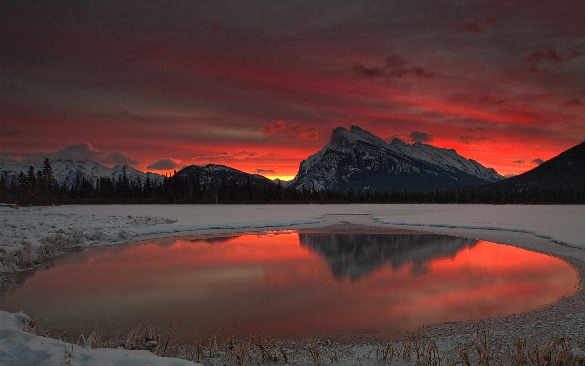 Sunset over snow-covered mountains and a reflective lake HD Wallpaper