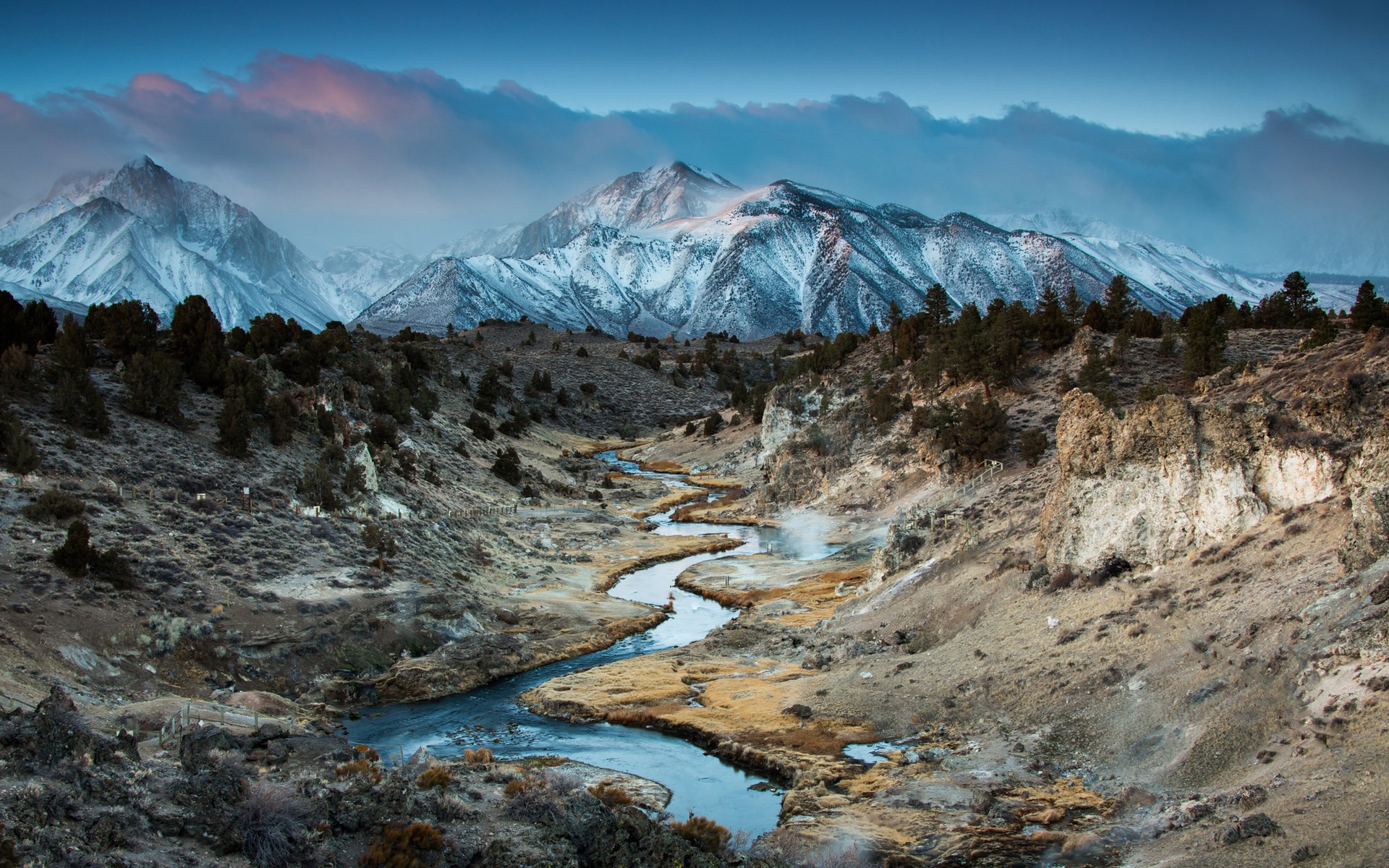Snow-capped mountains and a winding river valley HD Wallpaper