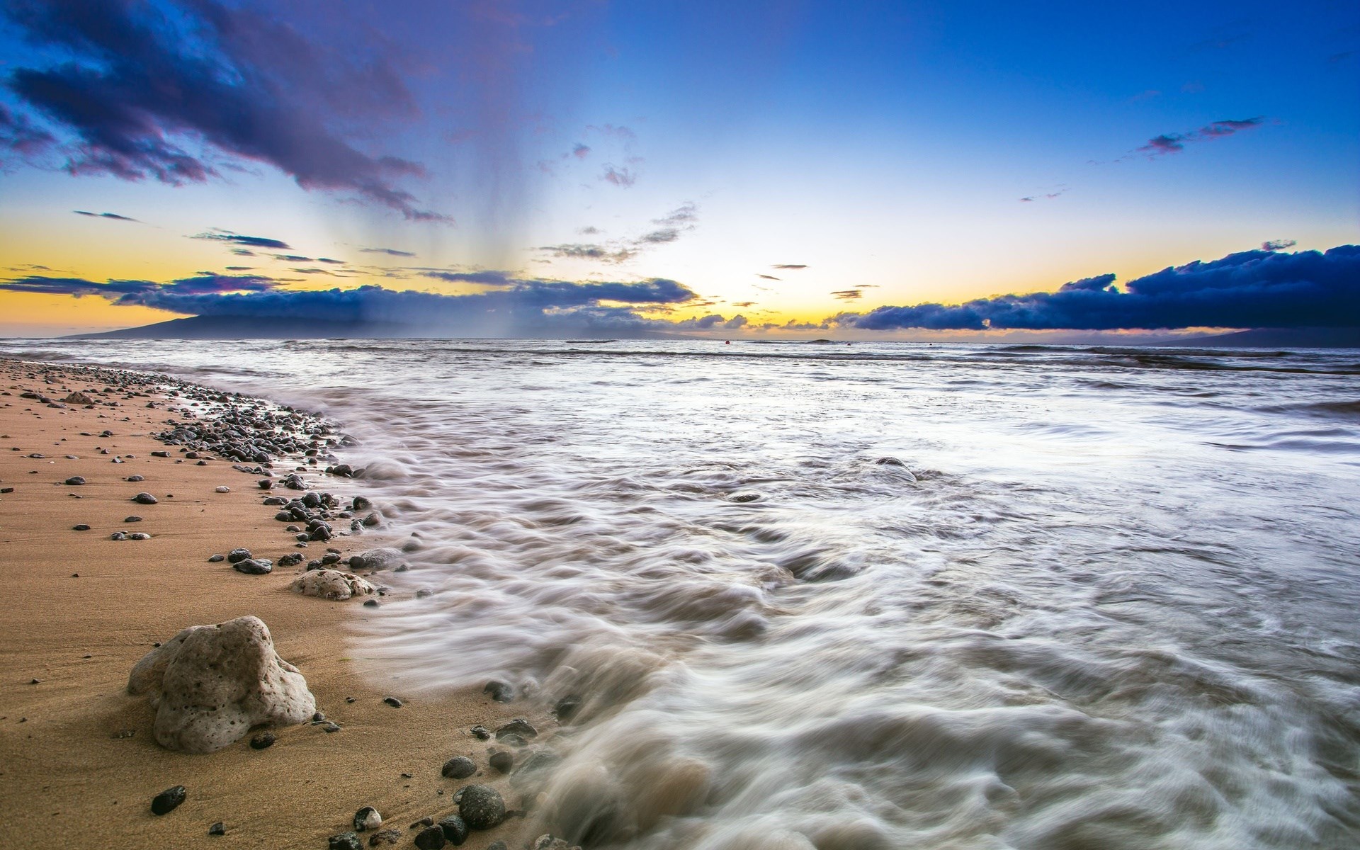 Ocean waves crashing on a rocky beach at sunset HD Wallpaper