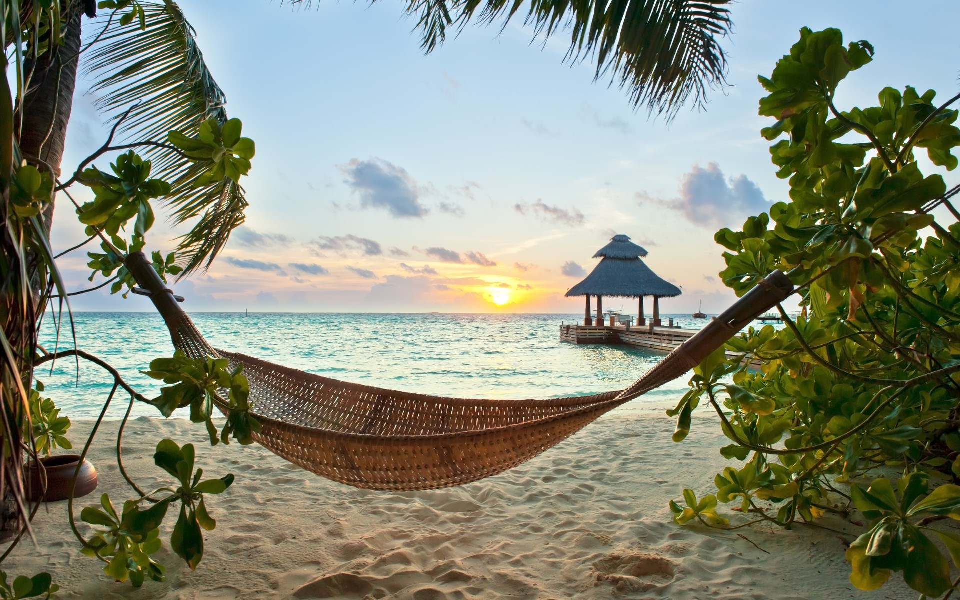 Hammock on a tropical beach at sunset HD Wallpaper