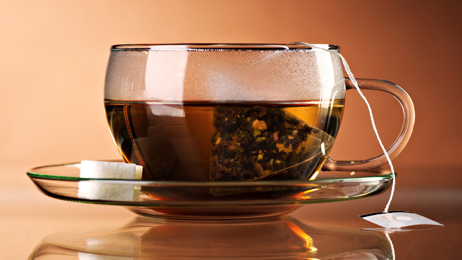 Cup of tea with sugar cubes HD Wallpaper