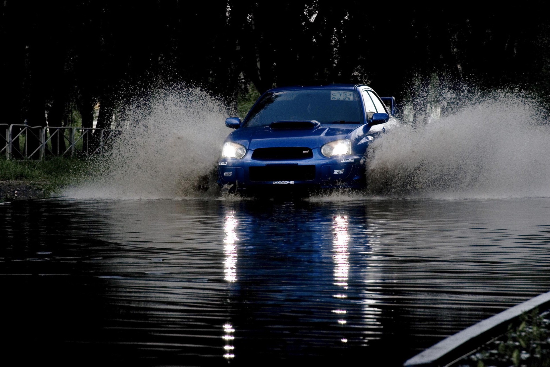 Blue Subaru Impreza driving through water HD Wallpaper