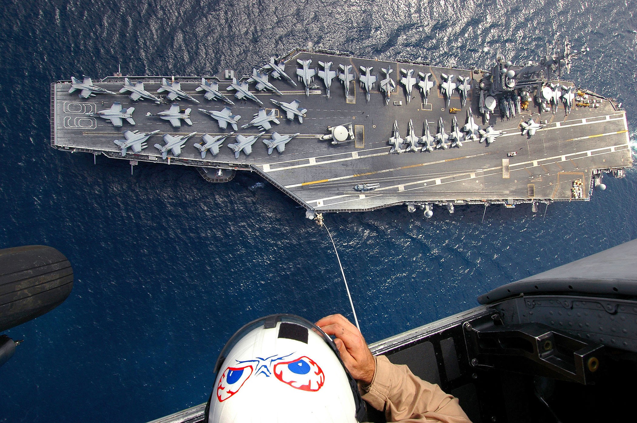 Aircraft carrier with fighter jets from helicopter HD Wallpaper