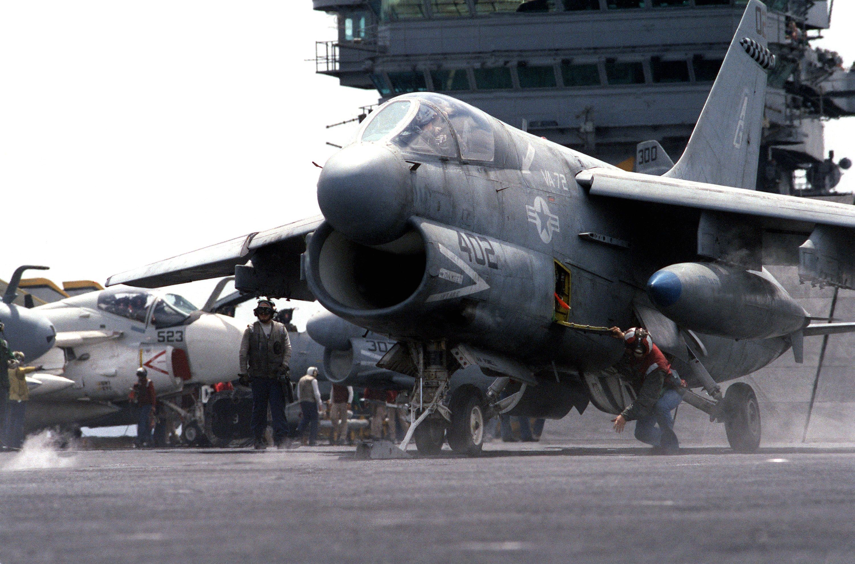 US Navy A-7 Corsair II aircraft on carrier deck HD Wallpaper