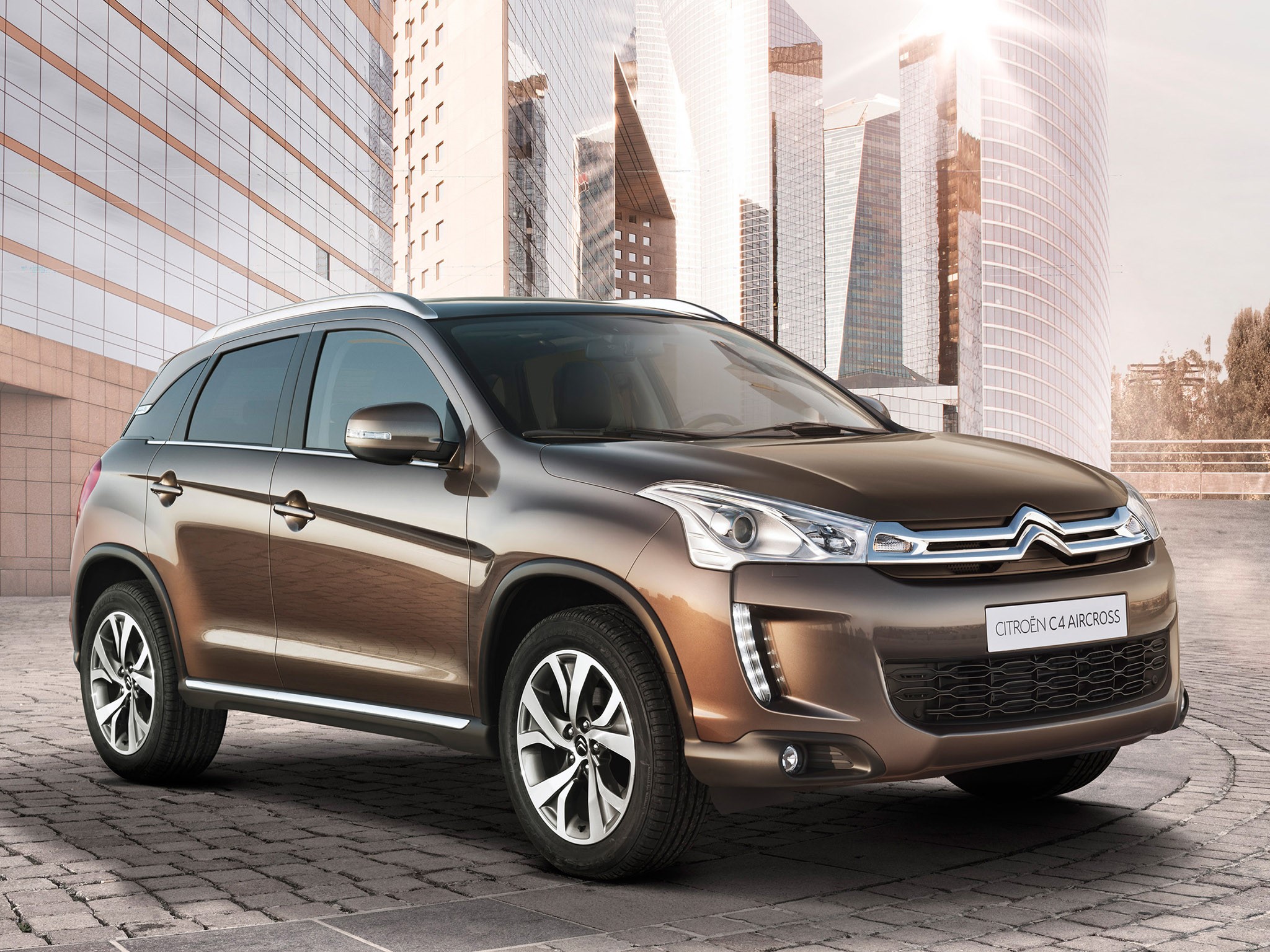 Citroen C4 Aircross parked in front of modern buildings HD Wallpaper