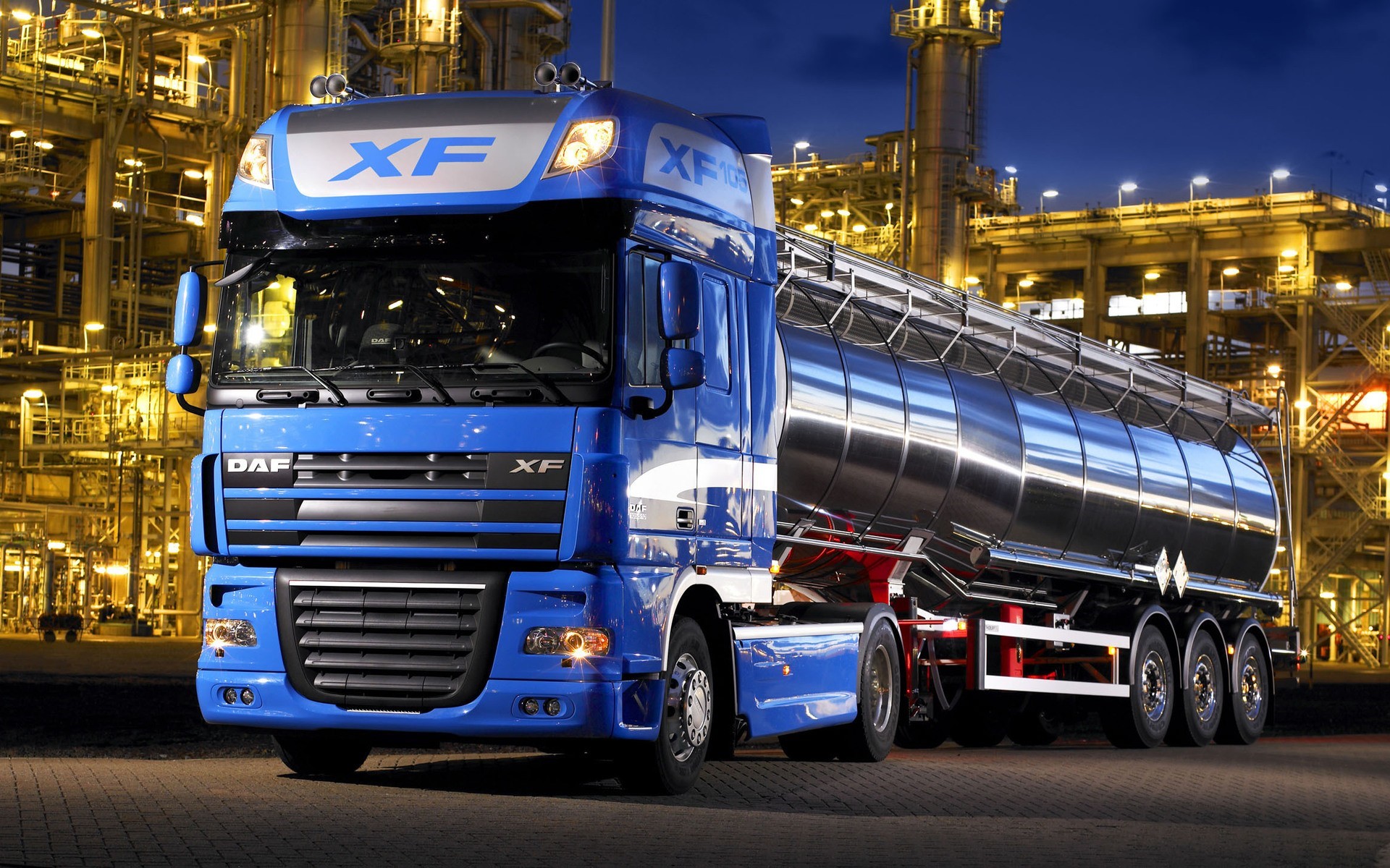 Blue DAF XF tanker truck at industrial plant HD Wallpaper