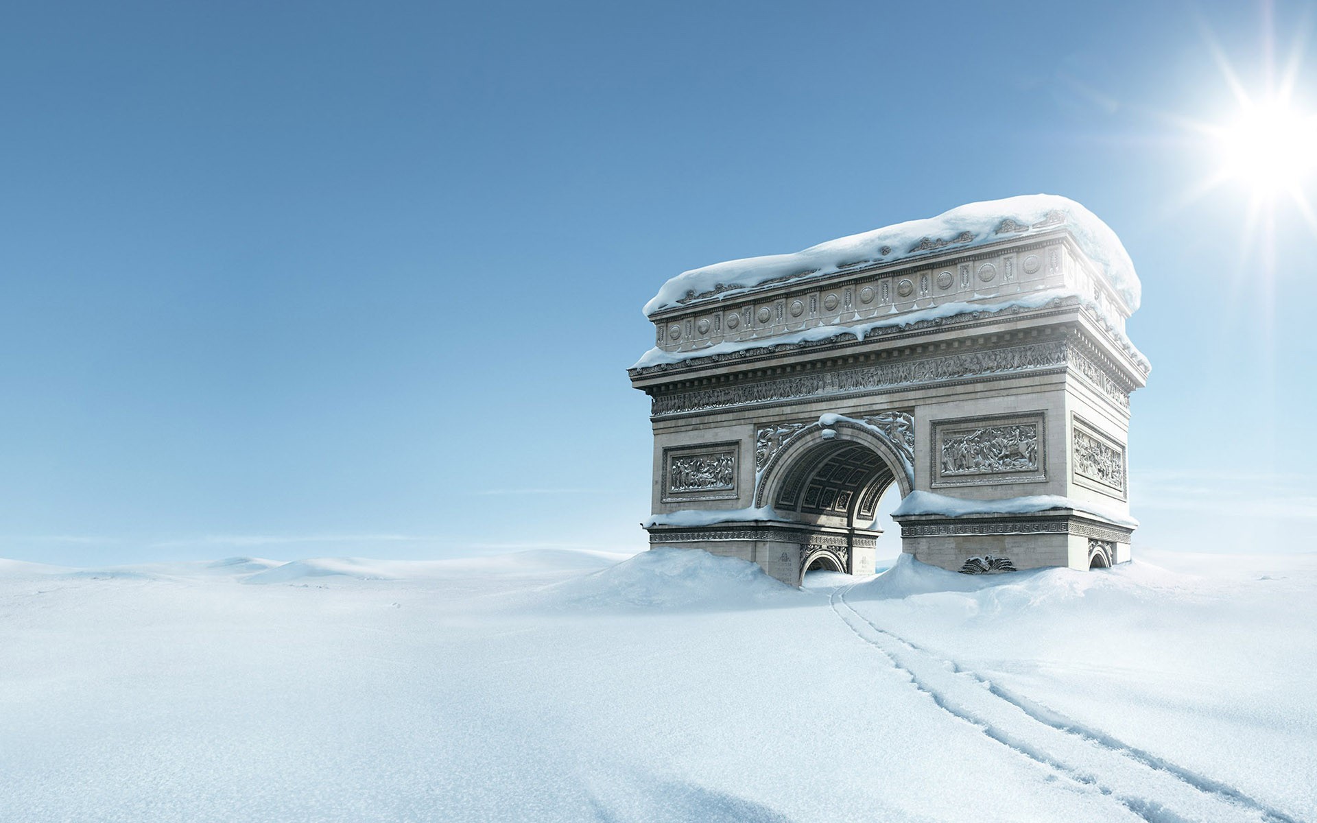 Arc de Triomphe covered in snow under a bright sun HD Wallpaper