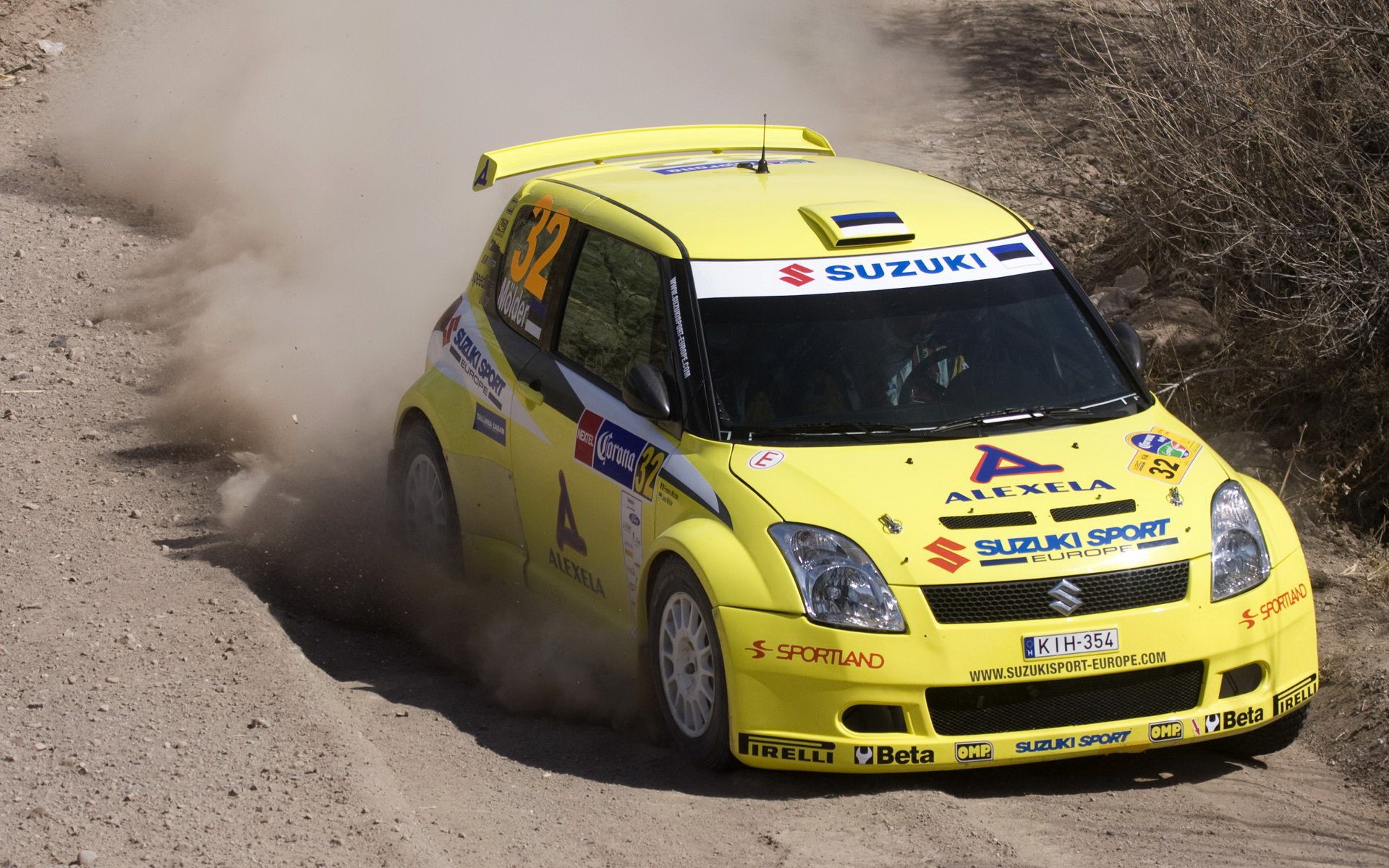 Yellow Suzuki Swift rally car on dirt track HD Wallpaper
