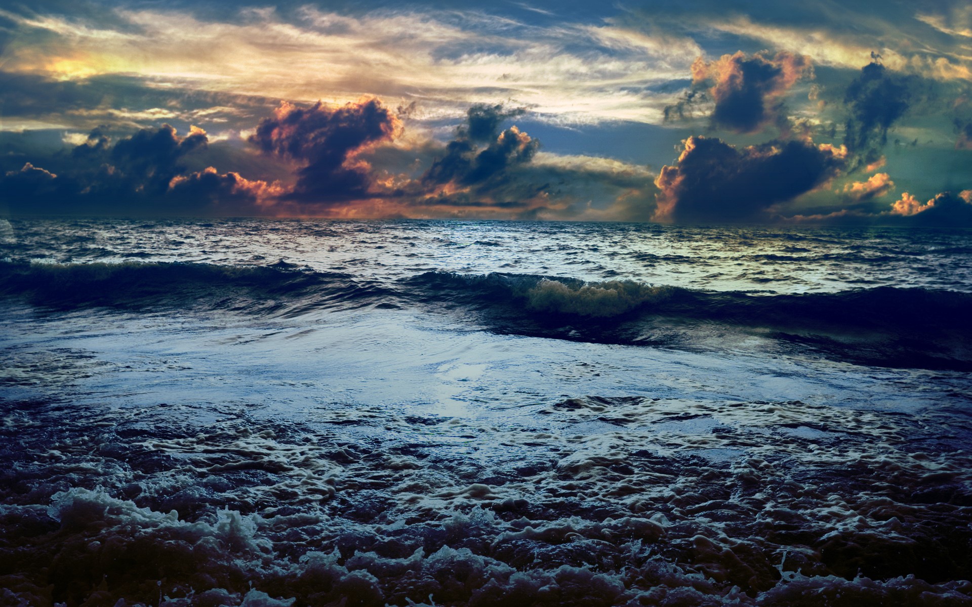 Stormy ocean waves under a dramatic sky HD Wallpaper