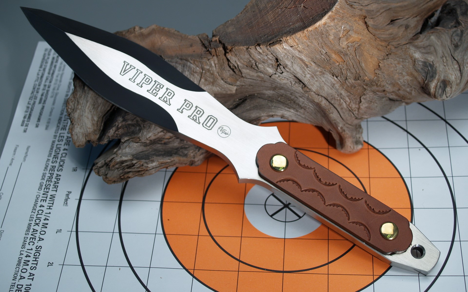 Viper Pro throwing knife on target paper HD Wallpaper