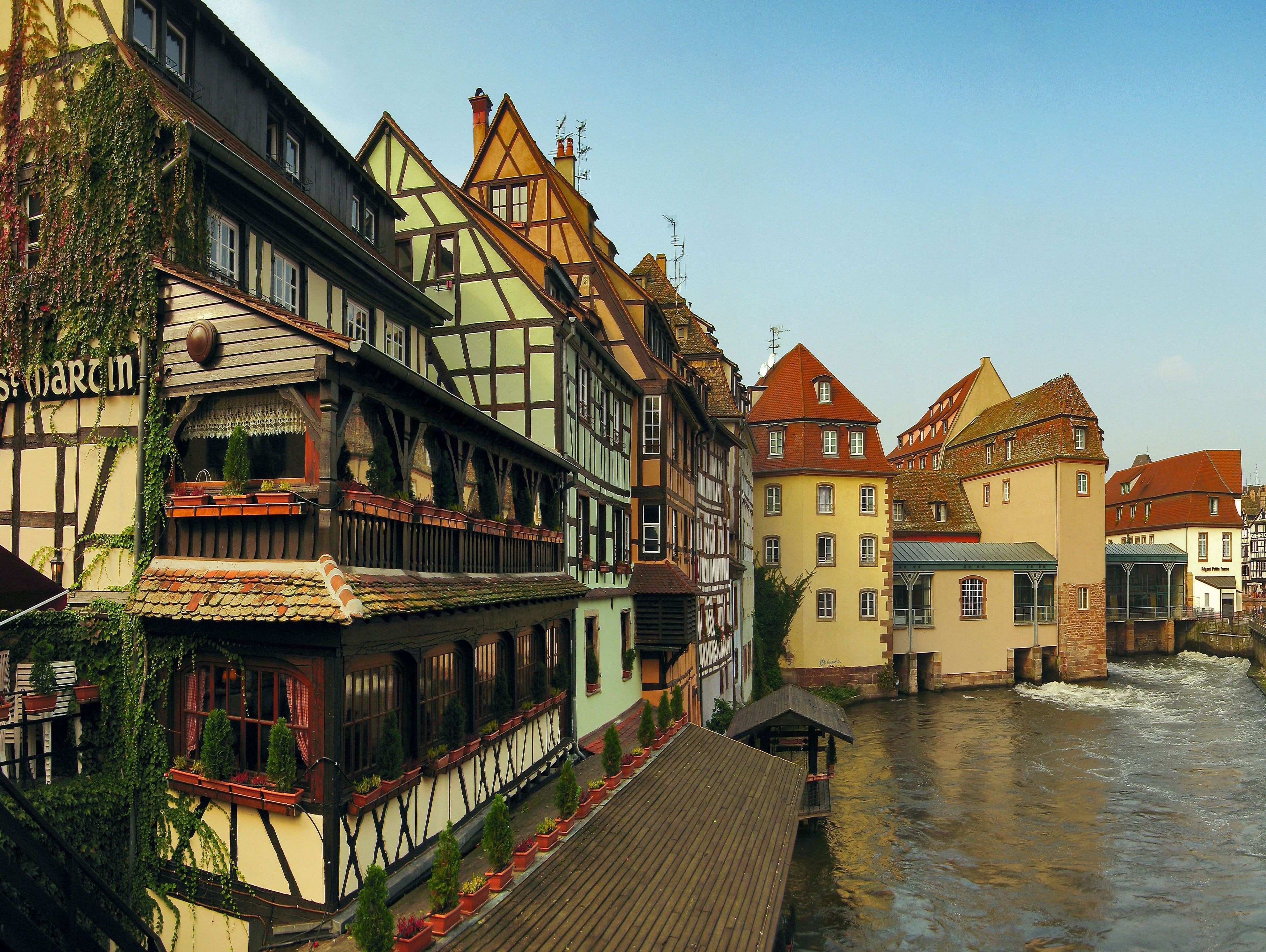 Half-timbered houses along a canal in Strasbourg, France HD Wallpaper