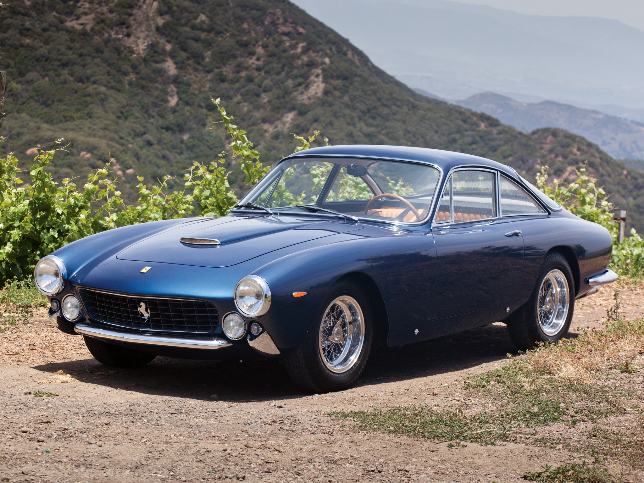 Blue Ferrari 250 GT parked on a dirt road HD Wallpaper