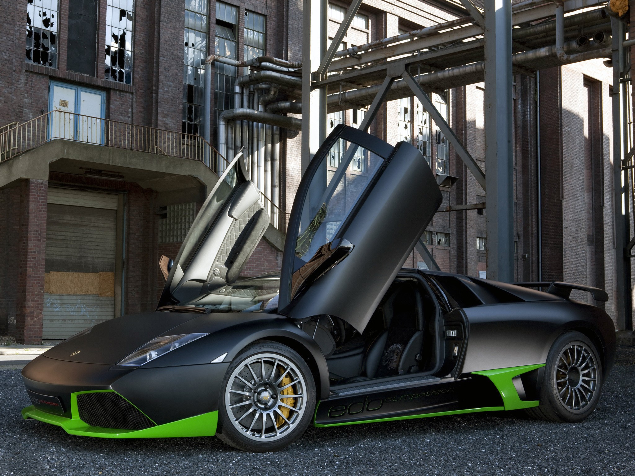Matte black Lamborghini Murcielago with green accents and open doors HD Wallpaper