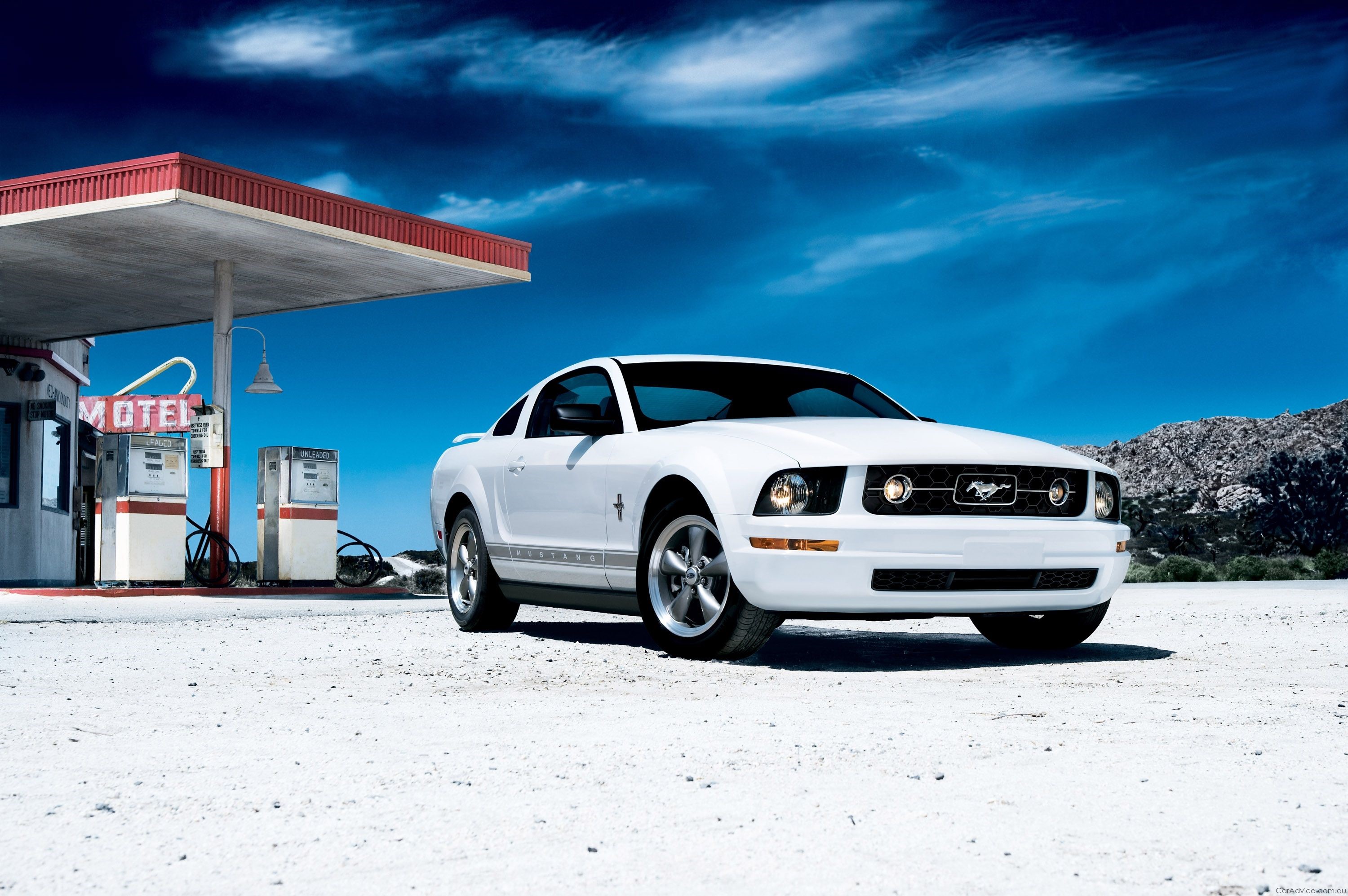 White Ford Mustang at a Desert Gas Station HD Wallpaper