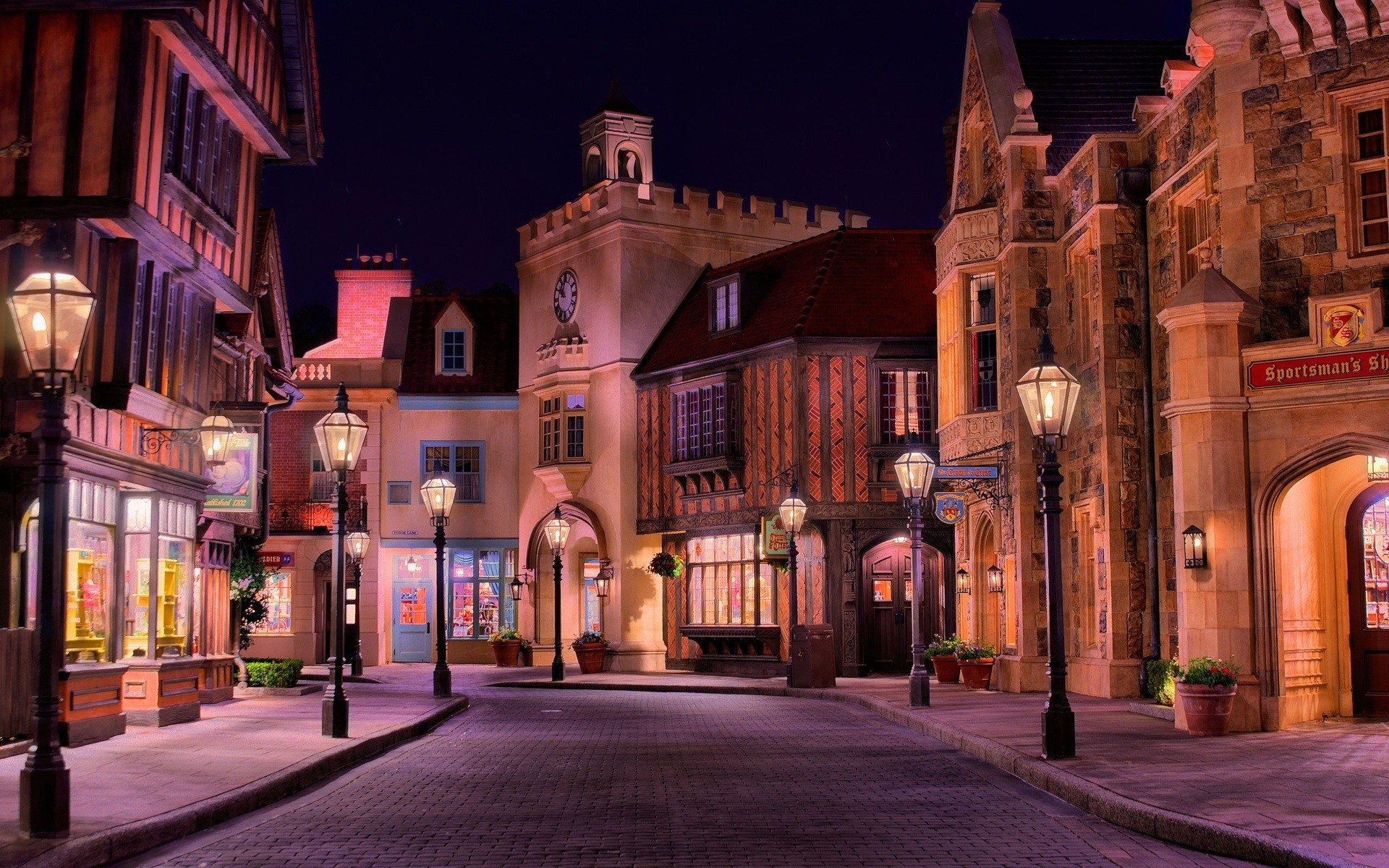 Nighttime street scene with European-style buildings and lampposts HD Wallpaper