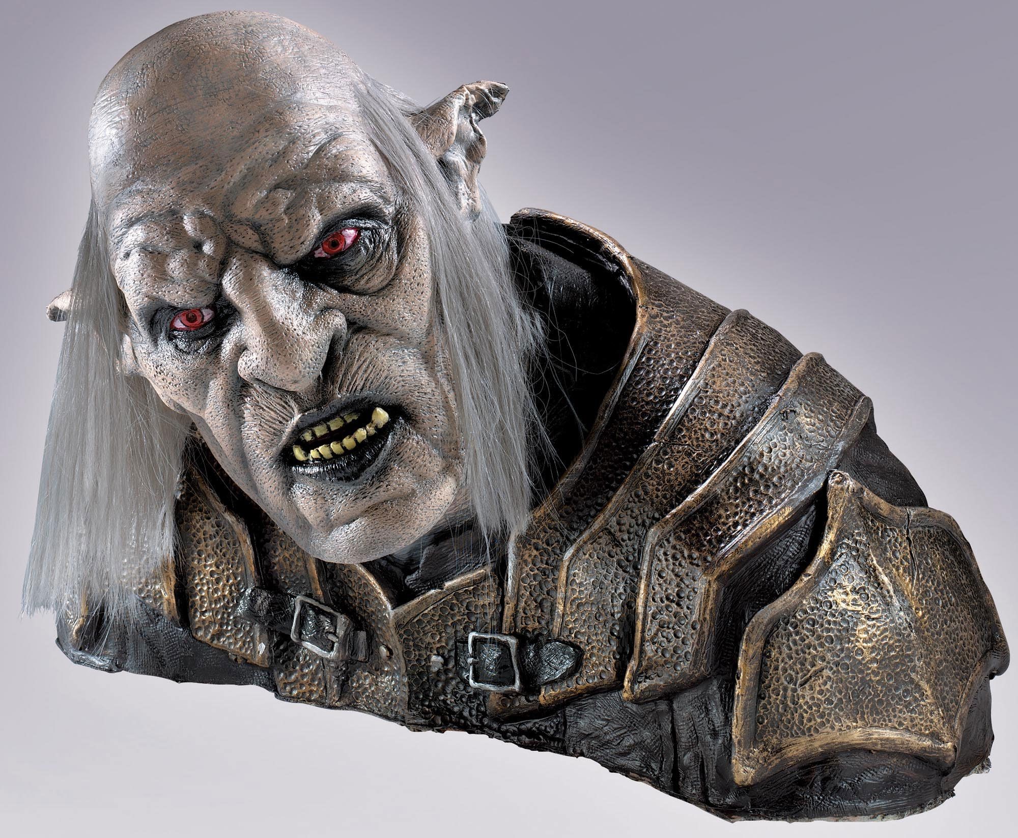Bust of a grotesque creature with red eyes and armor HD Wallpaper
