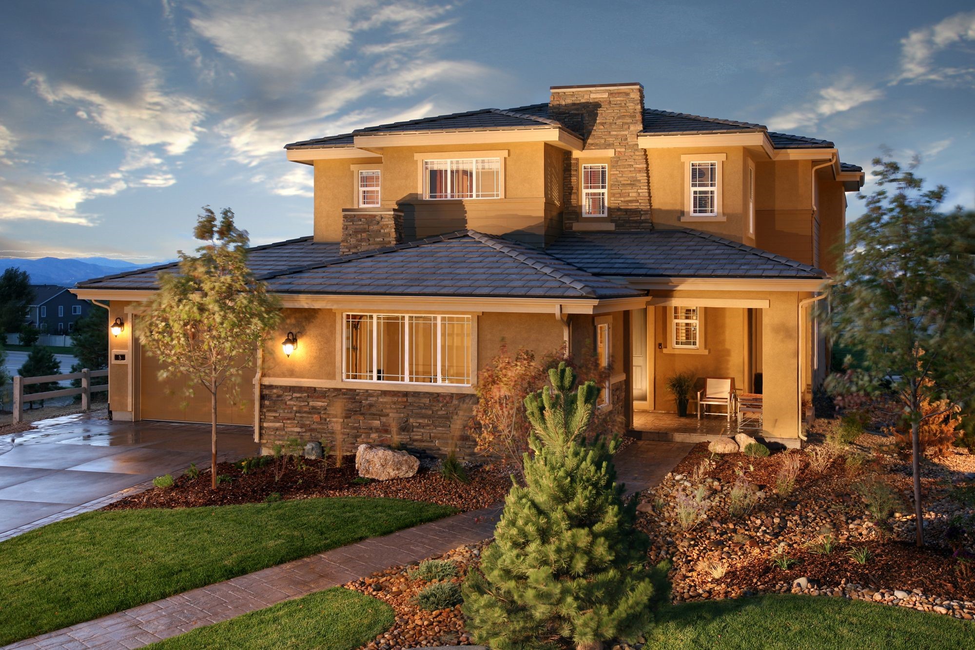 Two-story house with stone accents and a sloped roof HD Wallpaper
