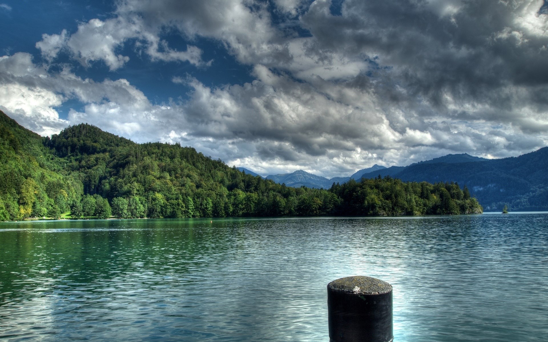 Lake with forested mountains and cloudy sky HD Wallpaper