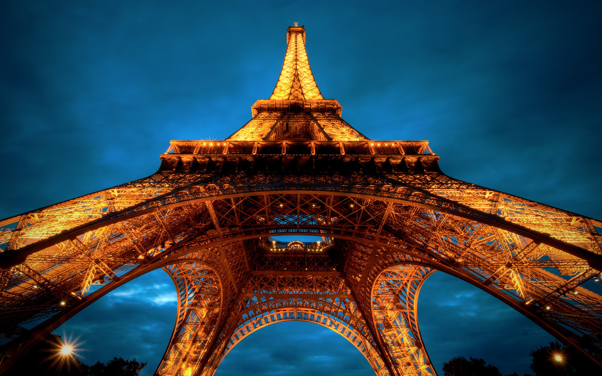 Eiffel Tower illuminated at night in Paris, France HD Wallpaper