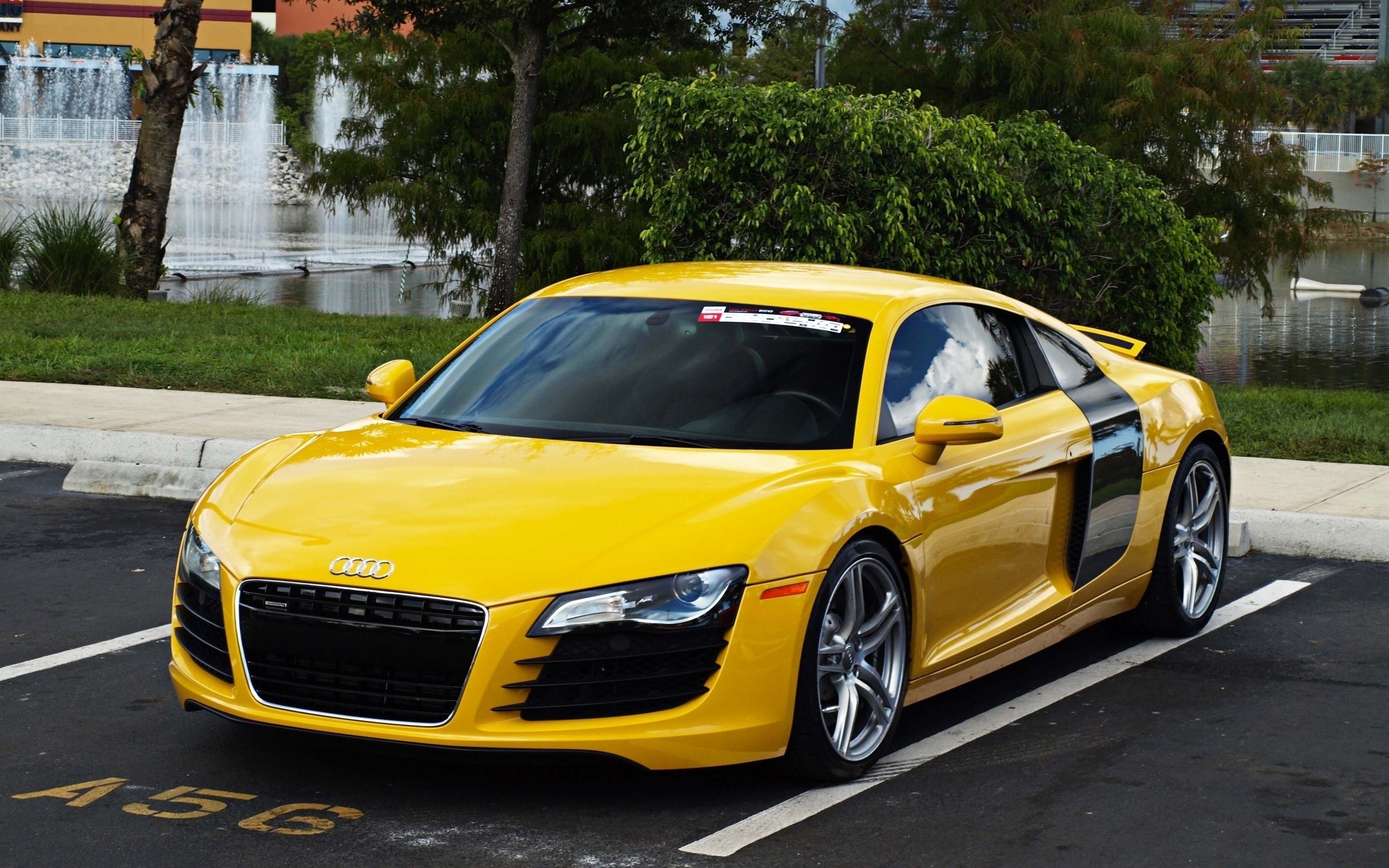 Yellow Audi R8 parked in a parking lot HD Wallpaper