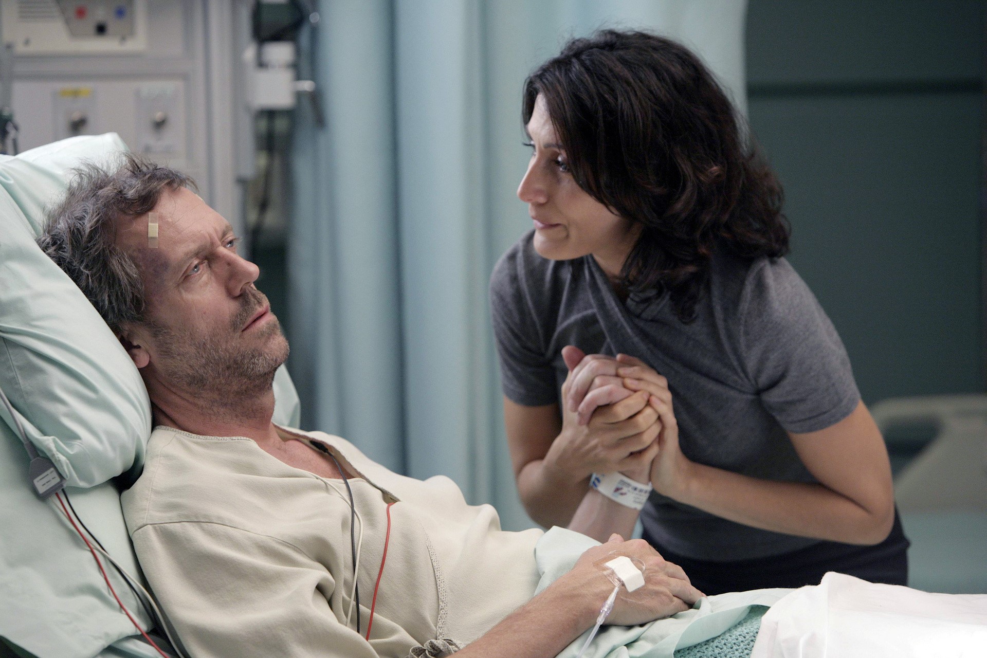 Hugh Laurie as Dr. House in a hospital bed HD Wallpaper