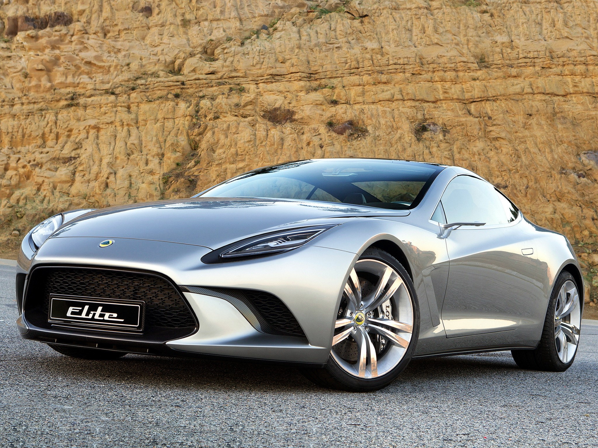 Silver Lotus Elite sports car on a road HD Wallpaper