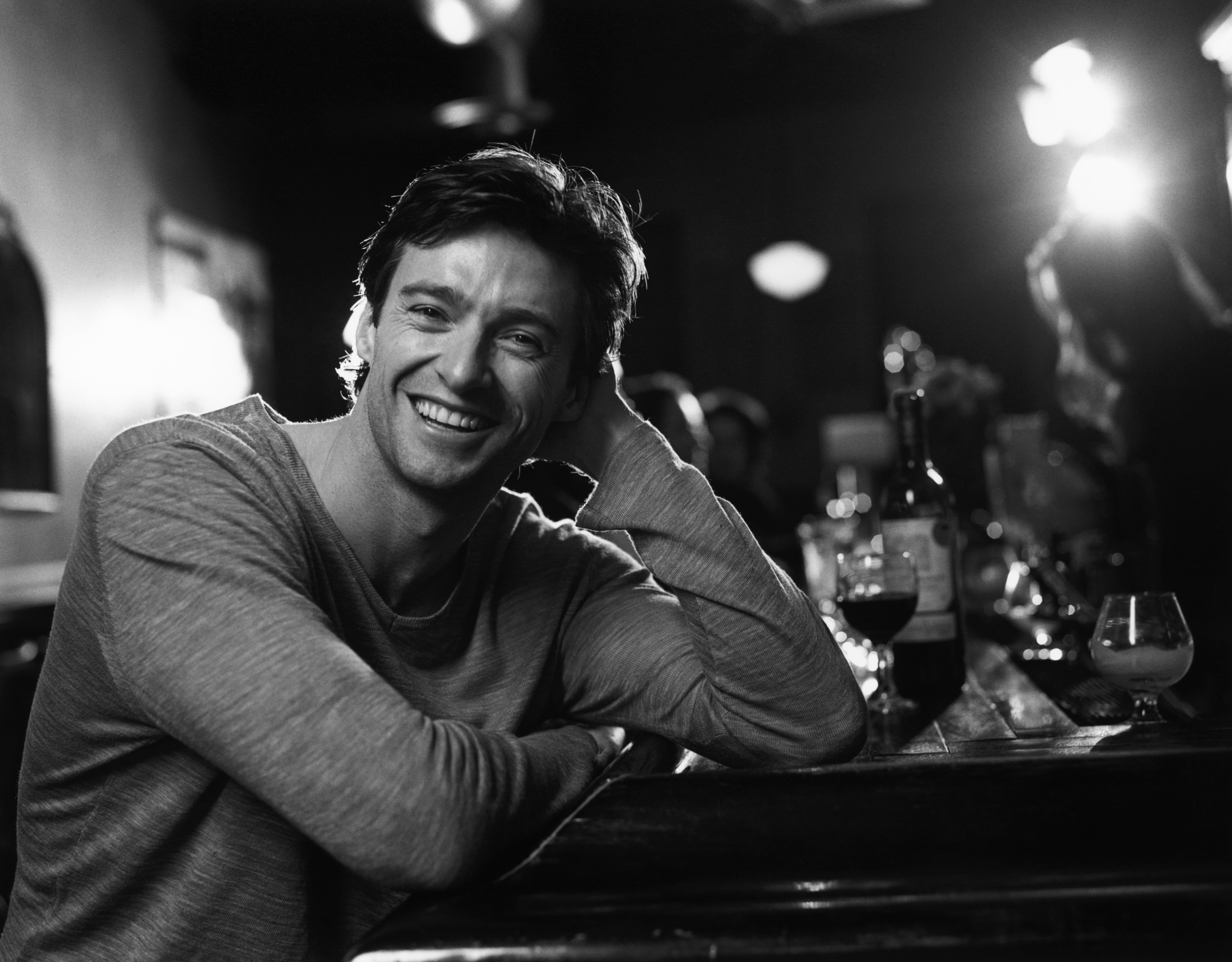 Hugh Jackman smiling at a bar HD Wallpaper