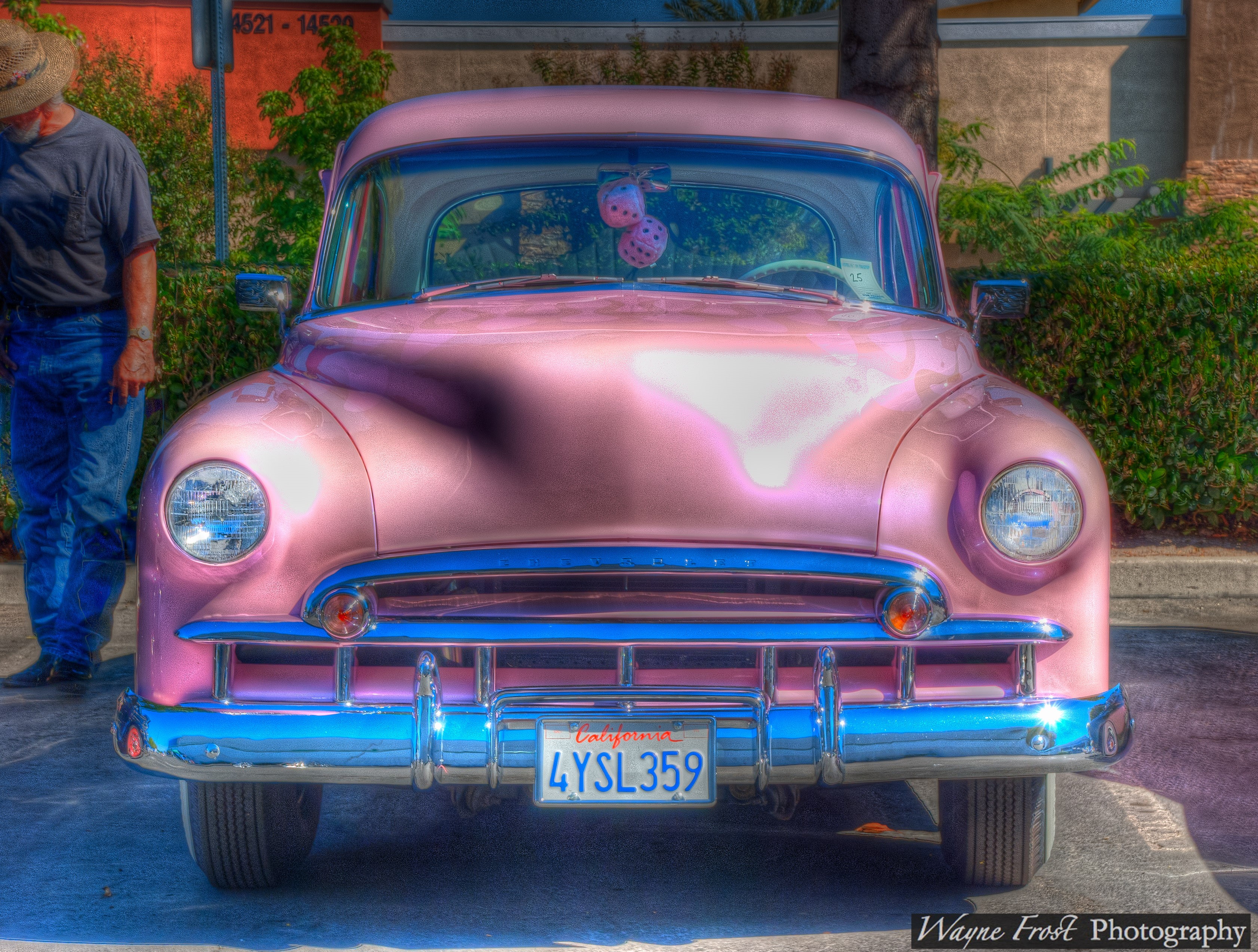 Pink Chevrolet with dice hanging from mirror HD Wallpaper