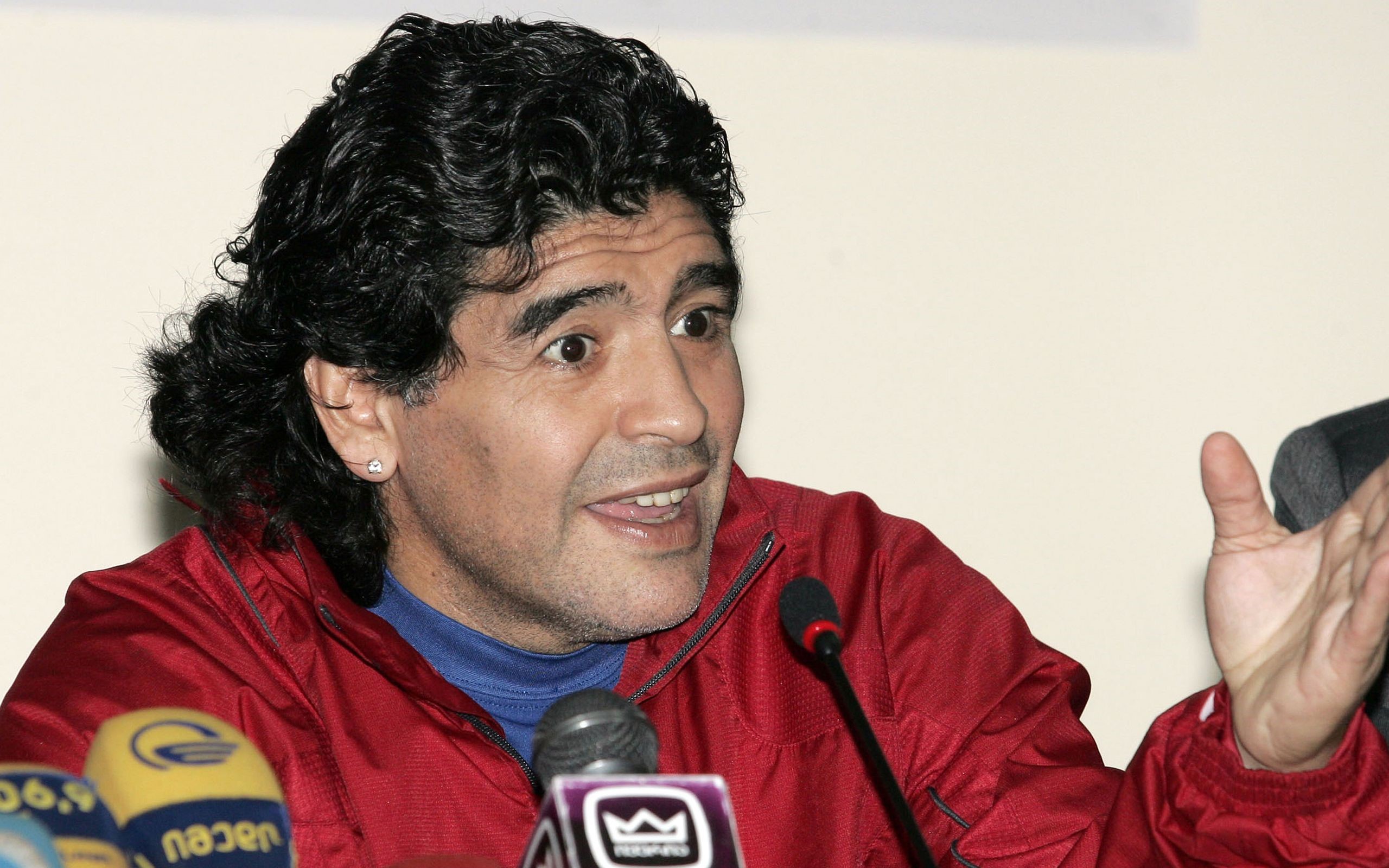 Diego Maradona speaking at a press conference HD Wallpaper