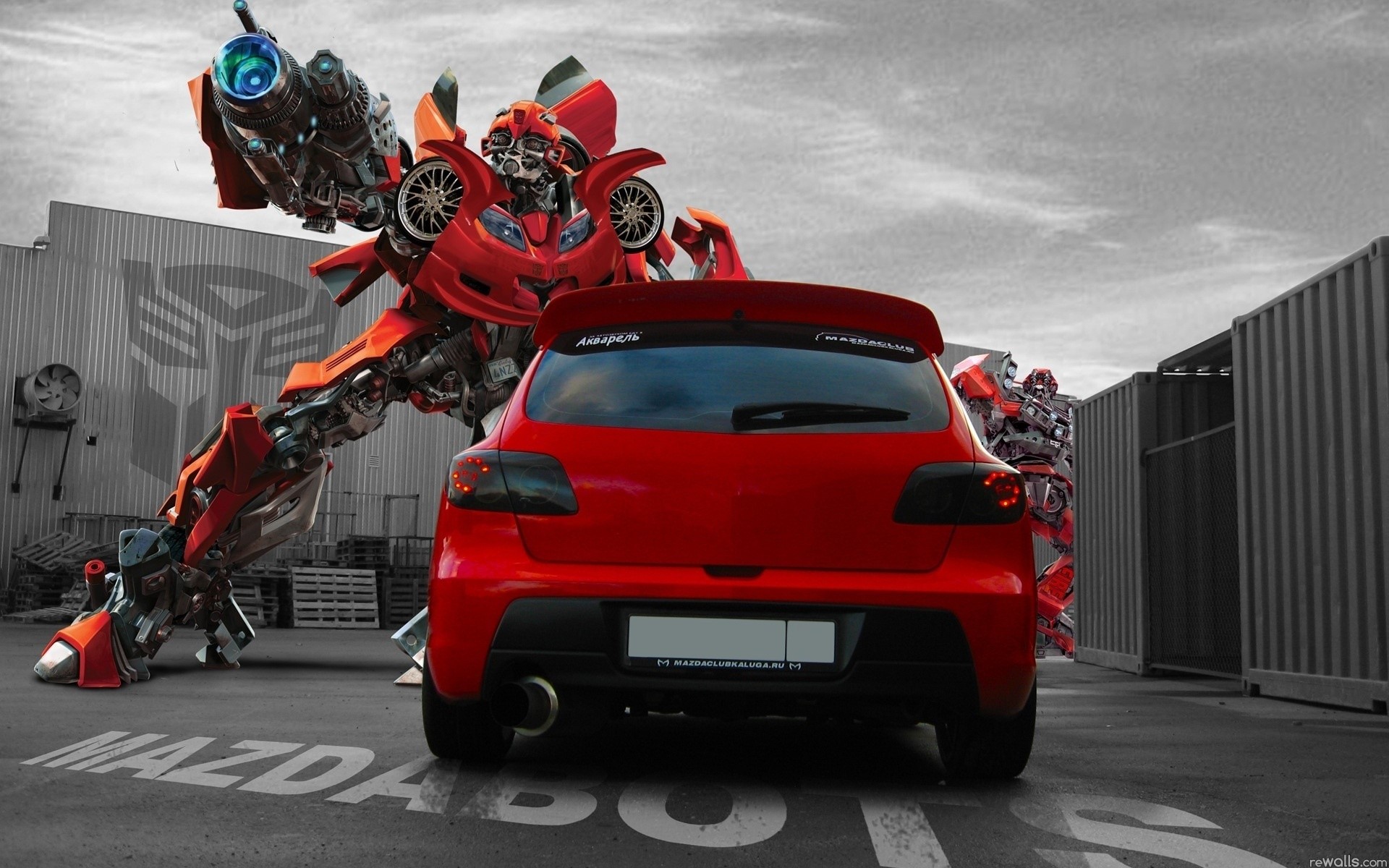 Red Mazda car with Transformers robots HD Wallpaper