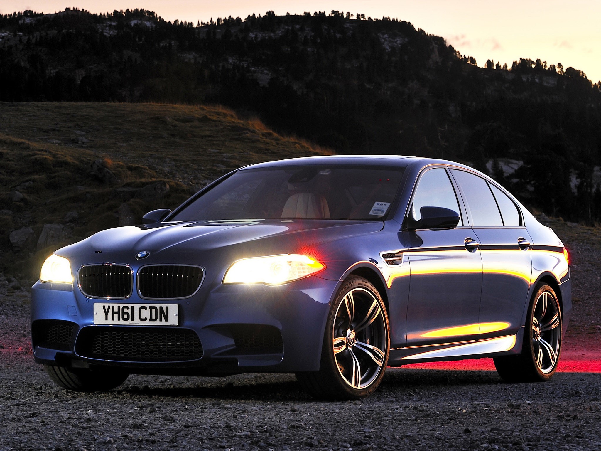 Blue BMW M5 Sedan on Gravel Road HD Wallpaper