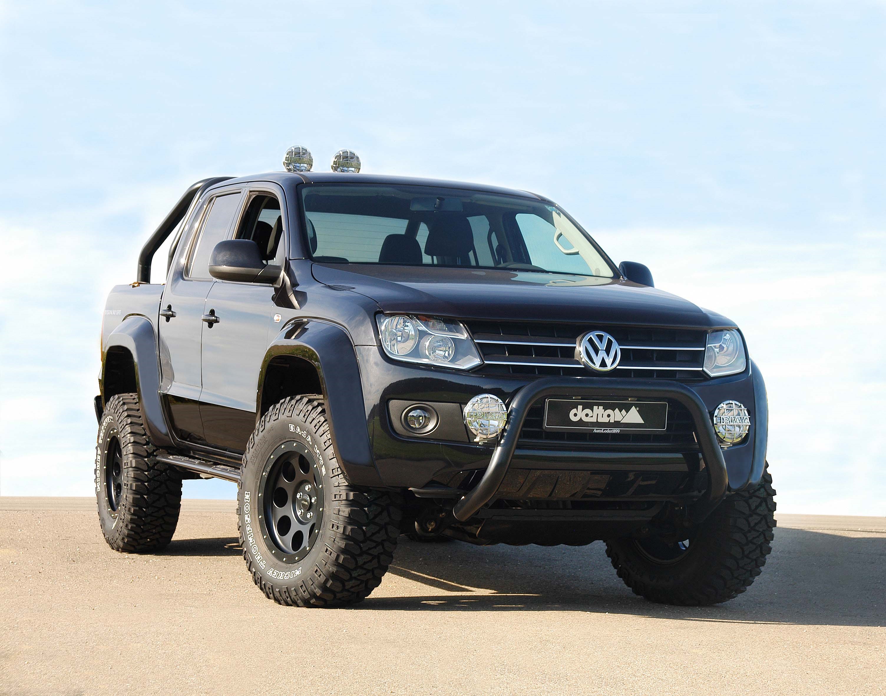 Black Volkswagen Amarok with off-road modifications HD Wallpaper