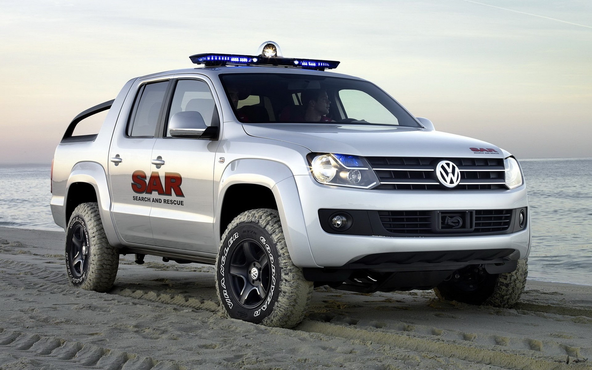 Silver Volkswagen Amarok Search and Rescue vehicle on beach HD Wallpaper