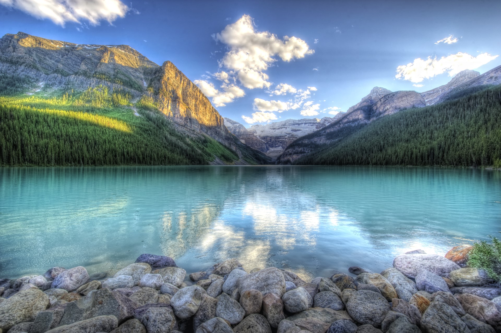 Turquoise lake and mountains with rocky shore HD Wallpaper