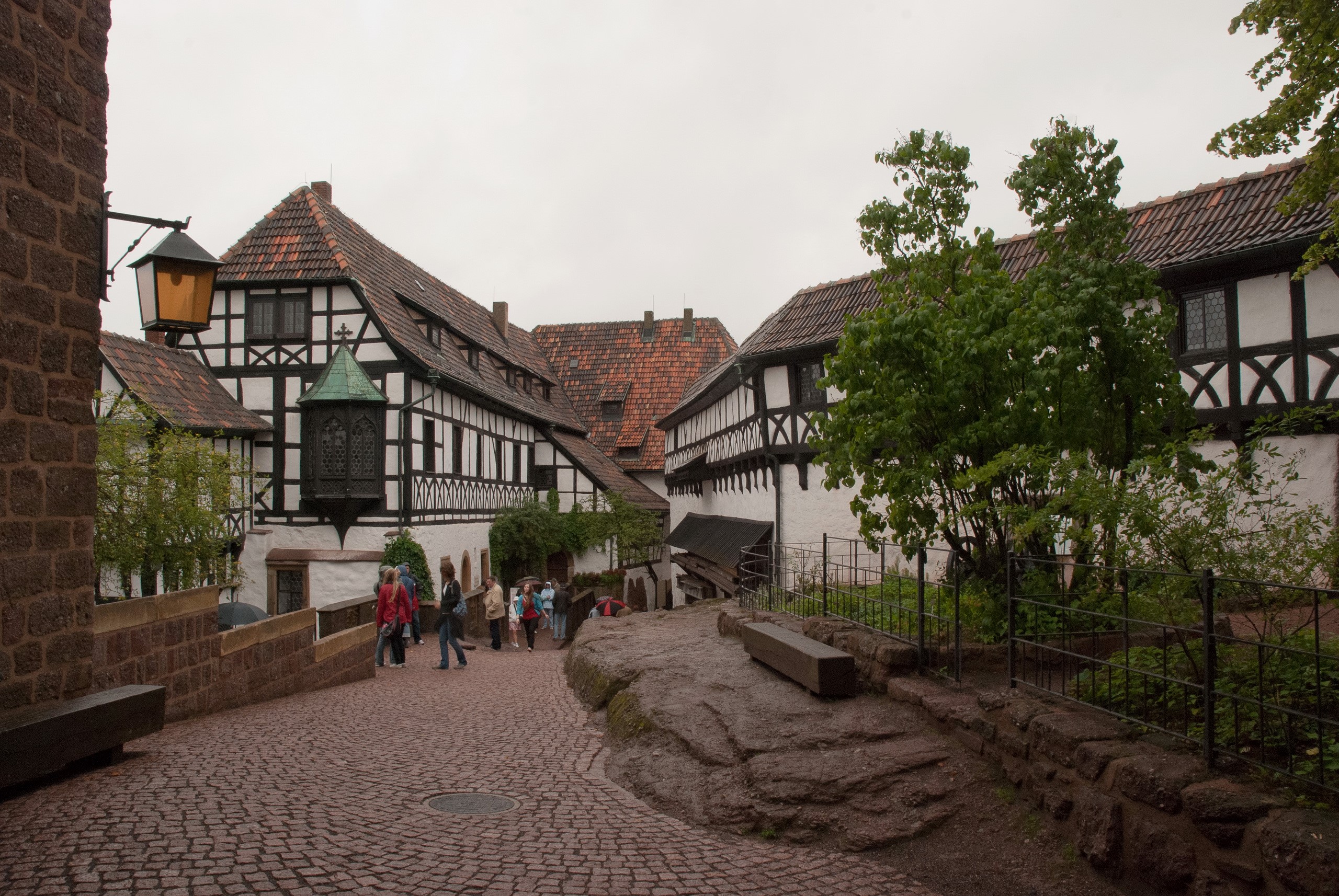 Half-timbered buildings in a castle courtyard HD Wallpaper