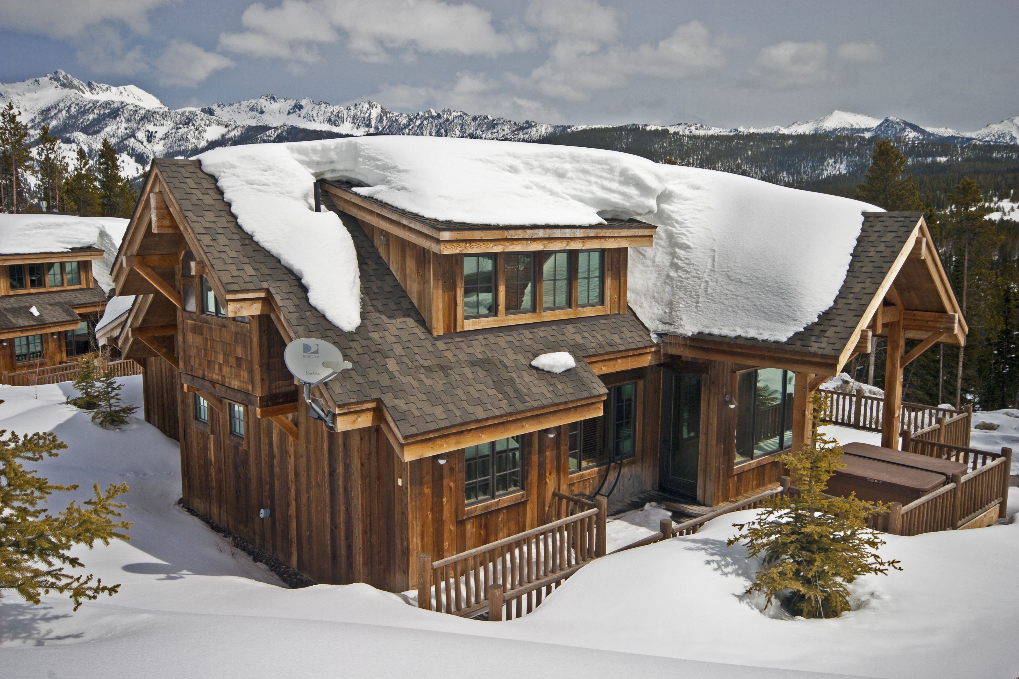 Wooden houses in snowy mountains HD Wallpaper
