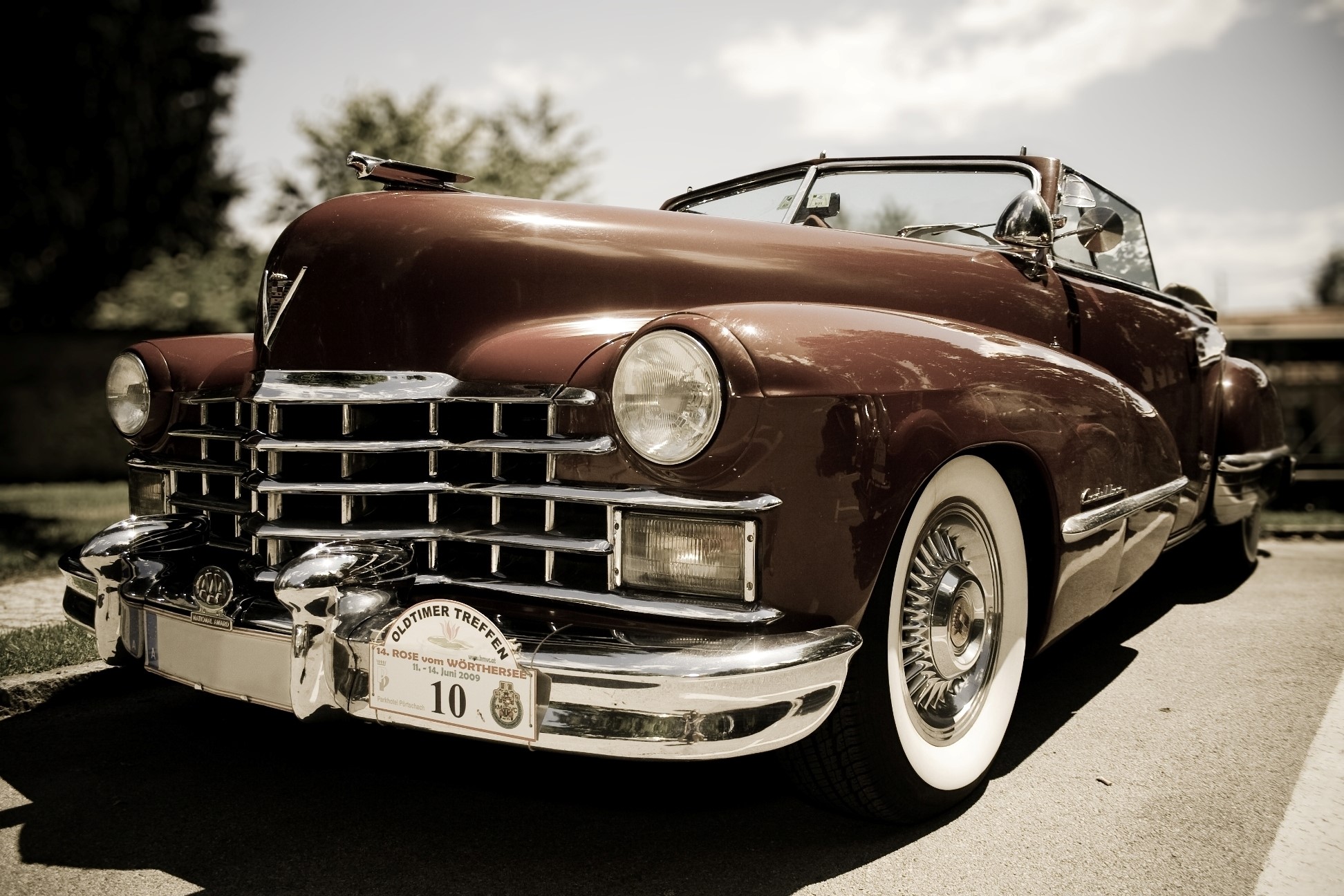 Vintage maroon Cadillac convertible with whitewall tires HD Wallpaper