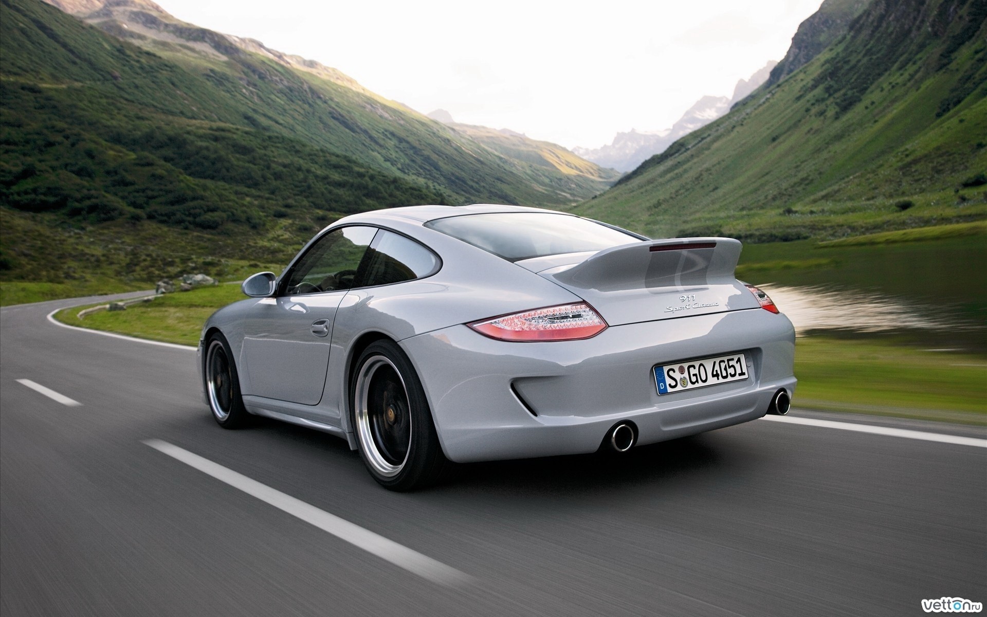 Porsche 911 driving on a mountain road HD Wallpaper
