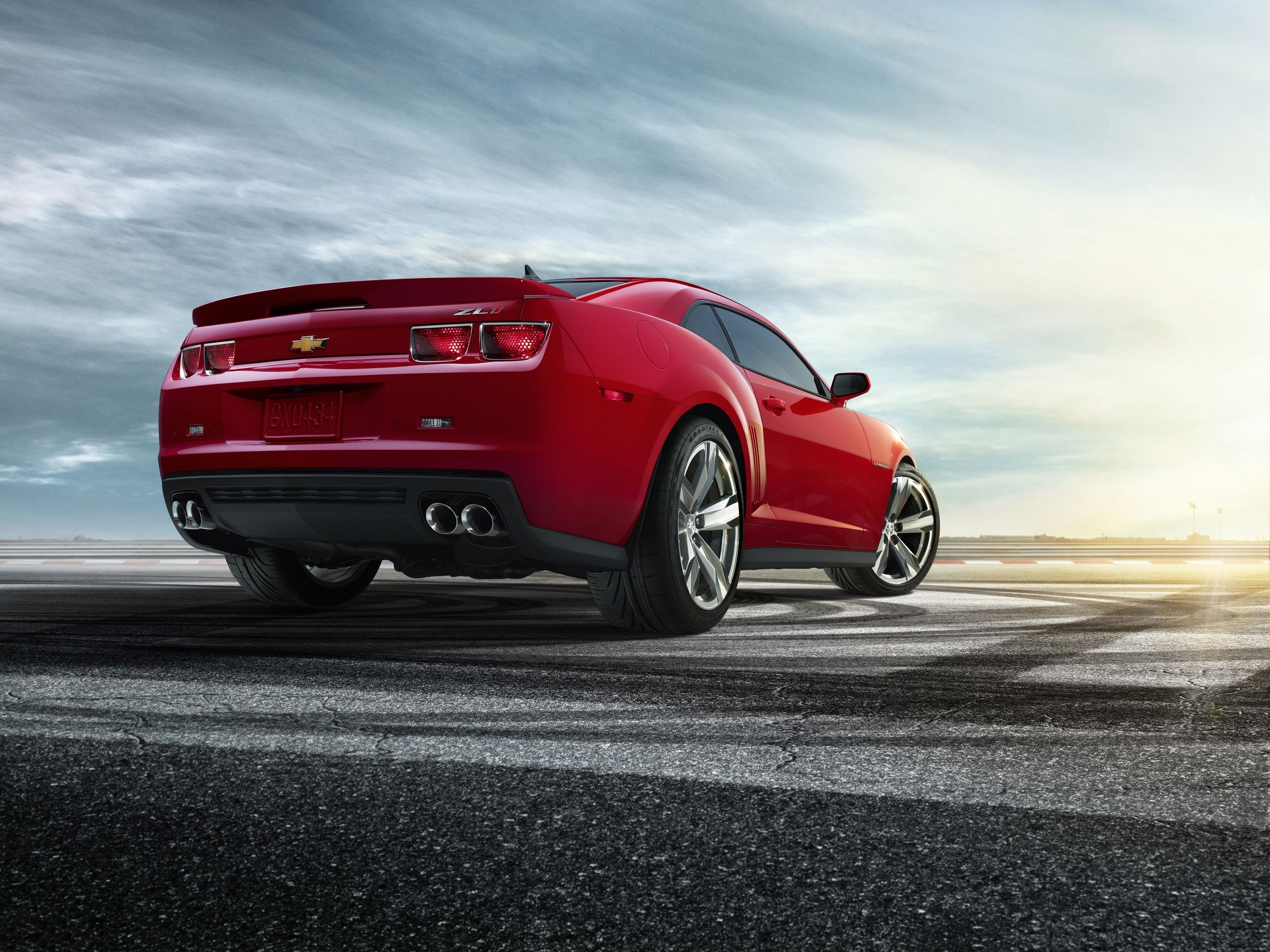 Red Chevrolet Camaro ZL1 on a Racetrack HD Wallpaper