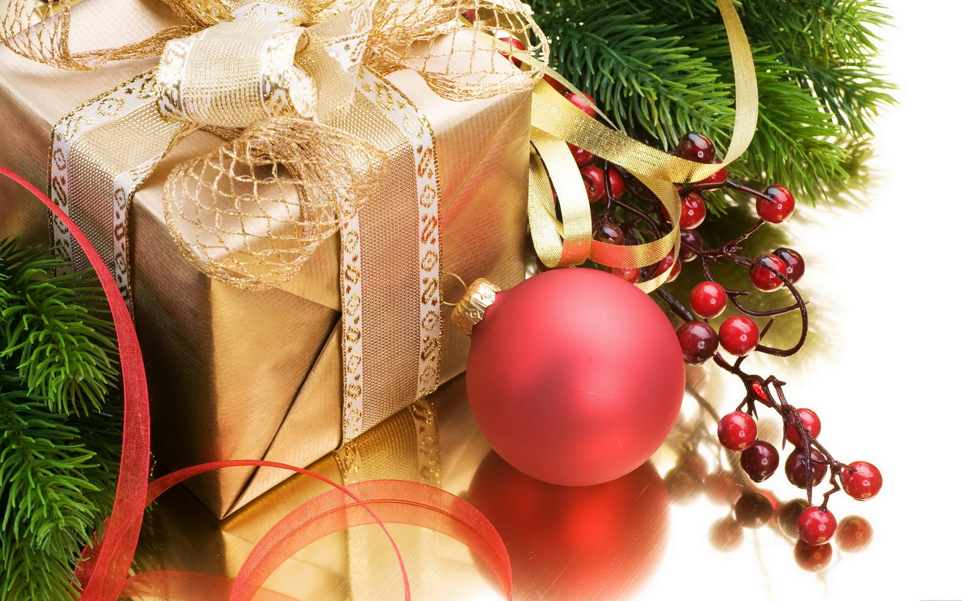 Christmas gift with ornament and pine branches HD Wallpaper
