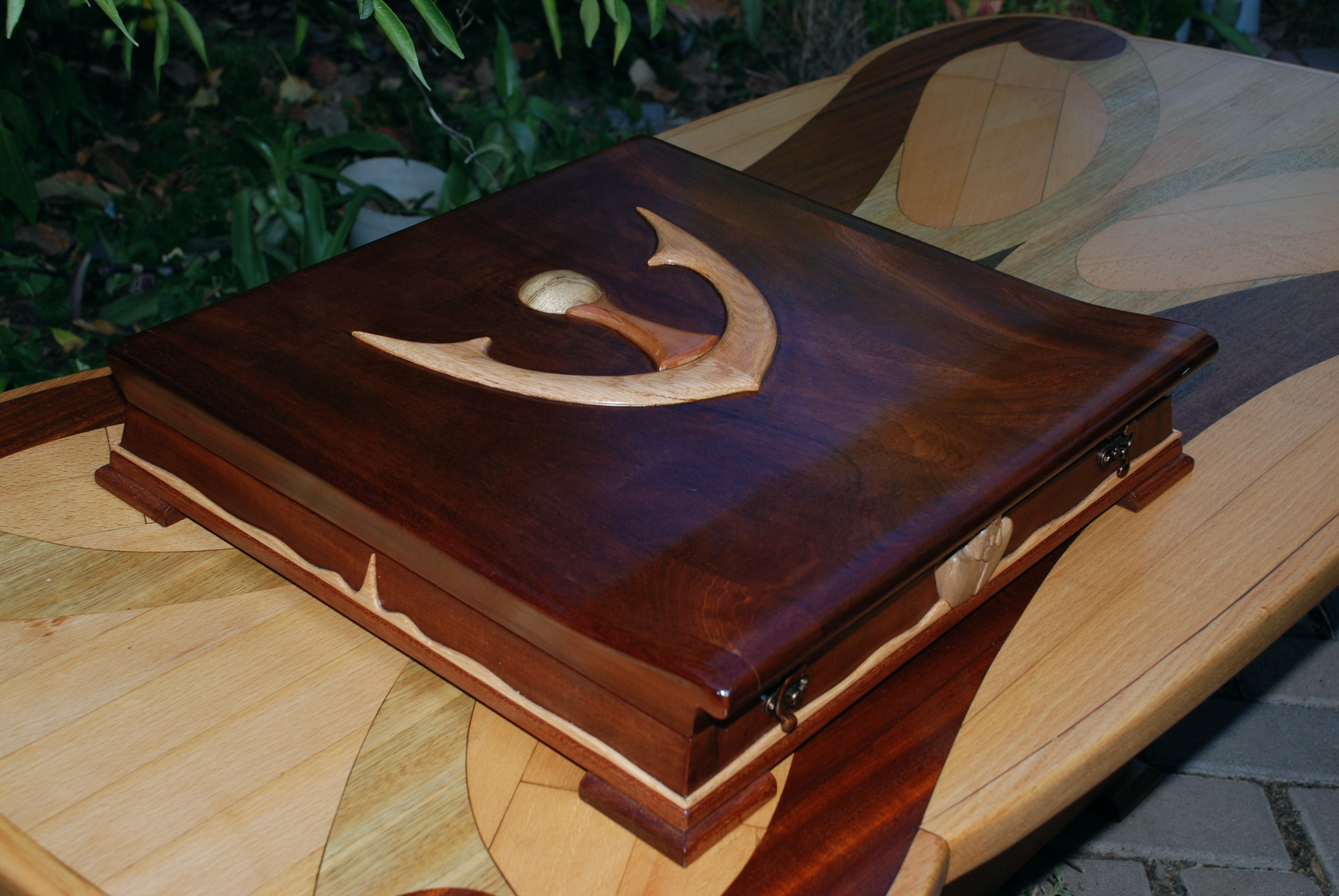 Decorative wooden box with inlay on a marquetry table HD Wallpaper
