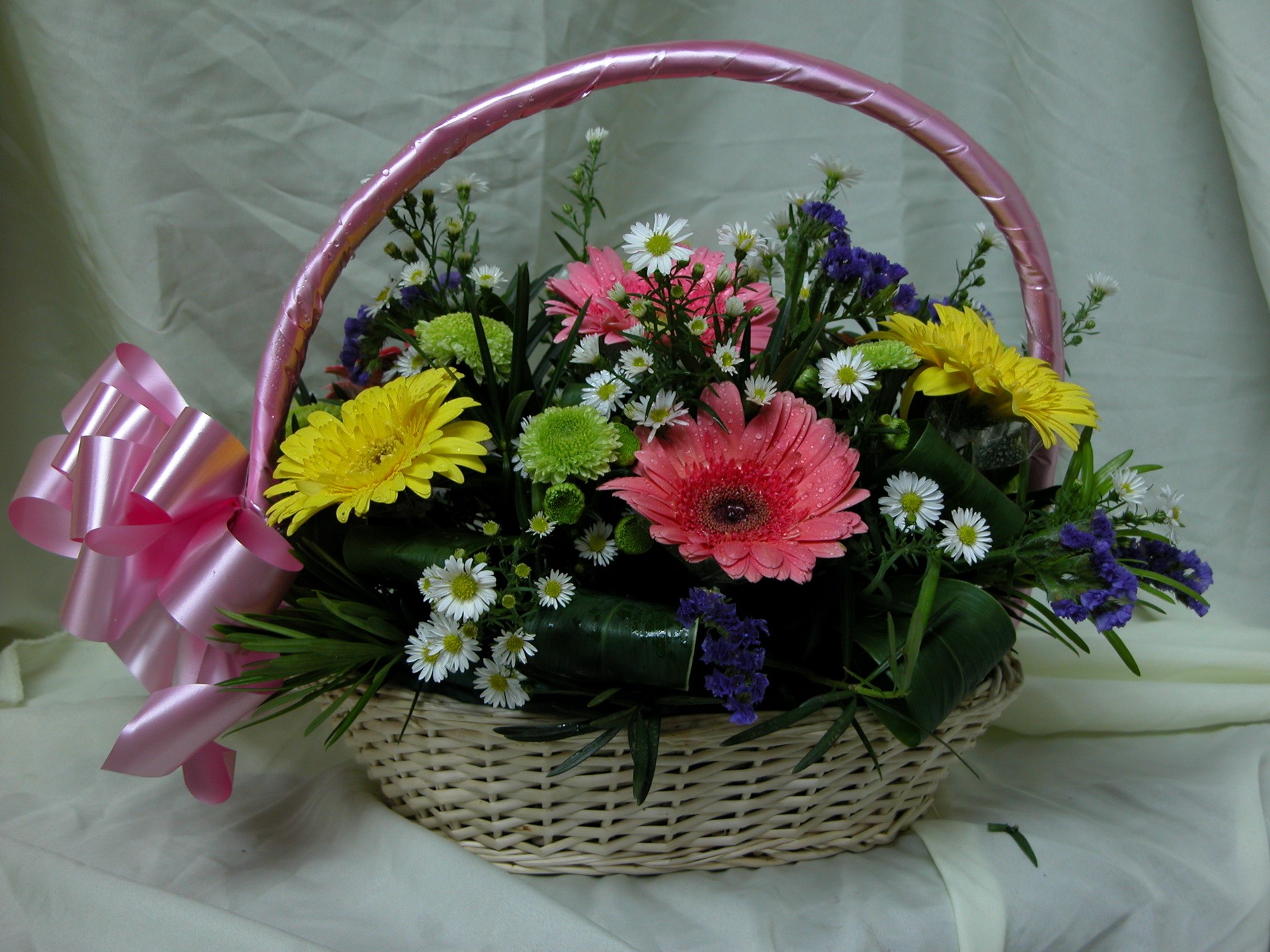 Flower basket with pink bow and assorted flowers HD Wallpaper