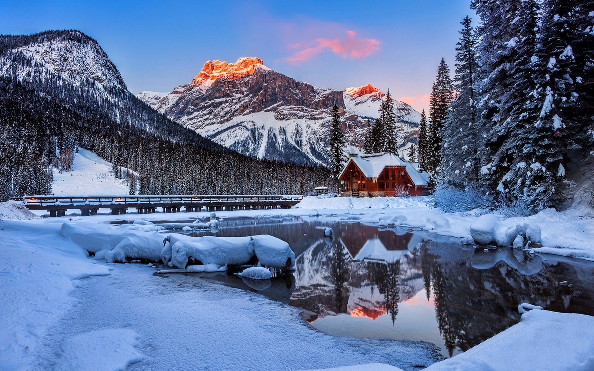 Snowy mountain landscape with a cabin and reflection HD Wallpaper