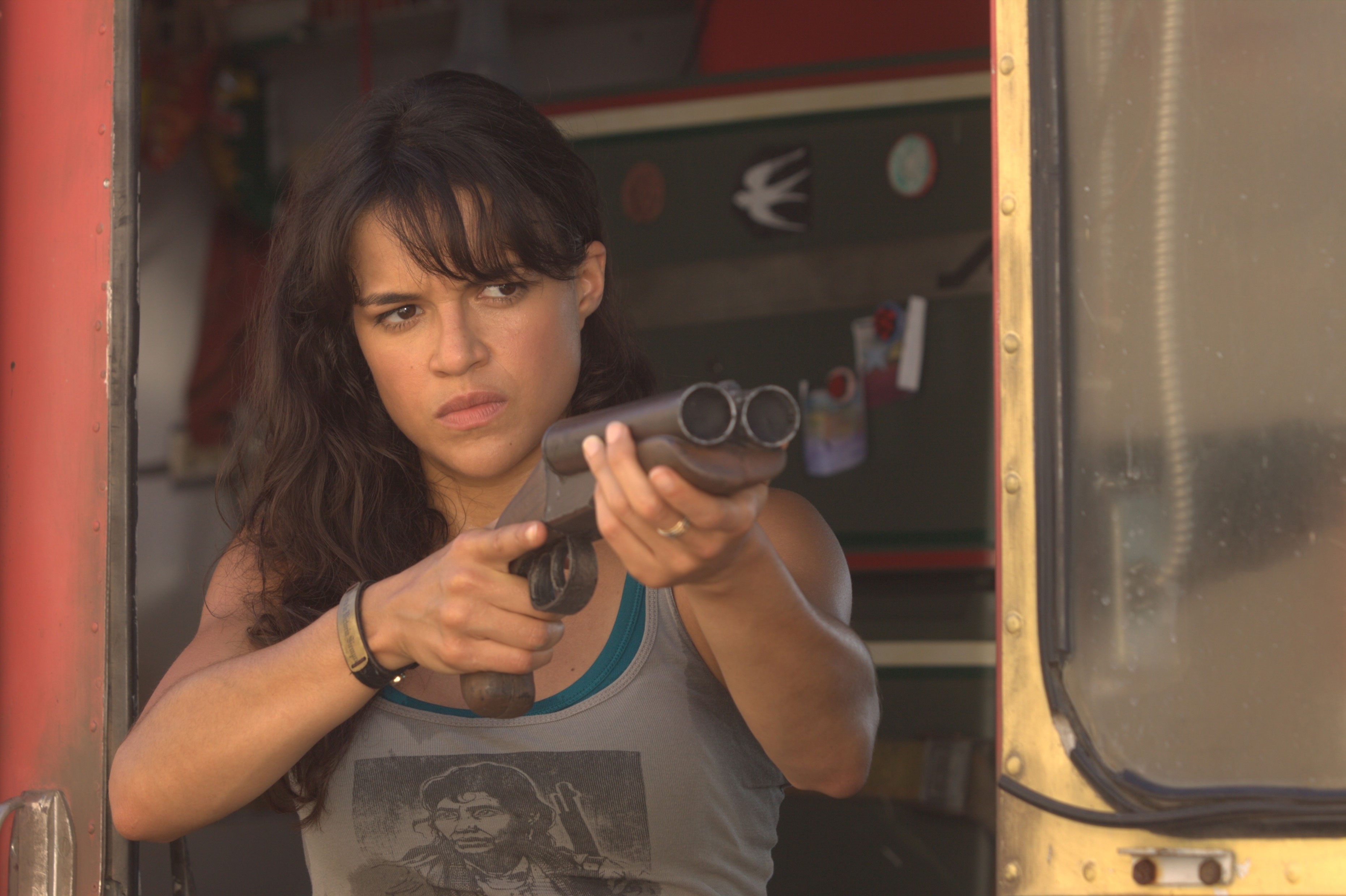 Michelle Rodriguez holding a shotgun HD Wallpaper