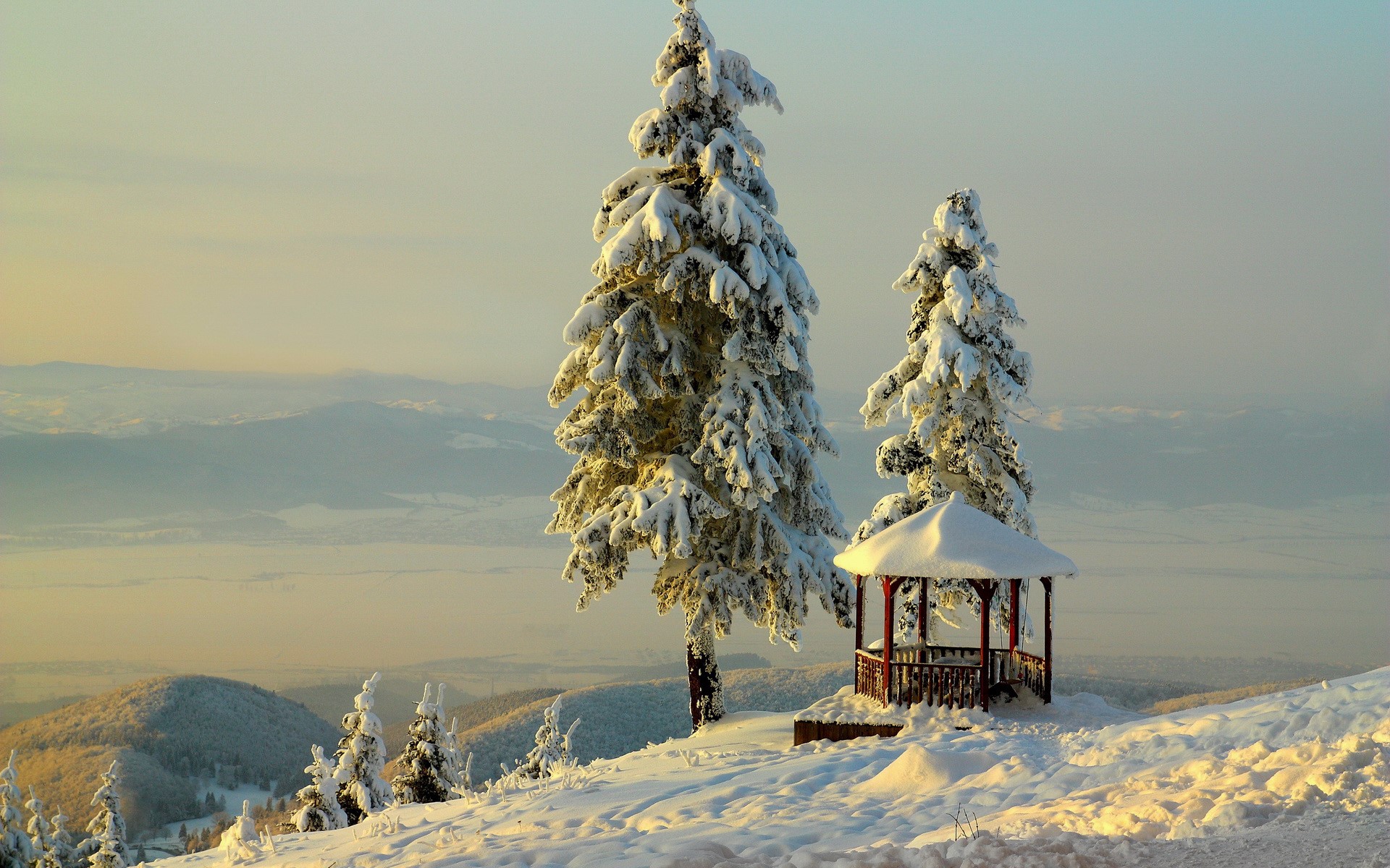 Snow-covered trees and gazebo on a mountain HD Wallpaper