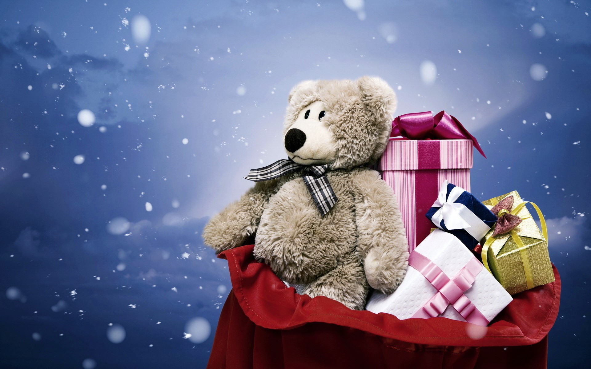 Teddy bear and Christmas gifts in a red bag HD Wallpaper