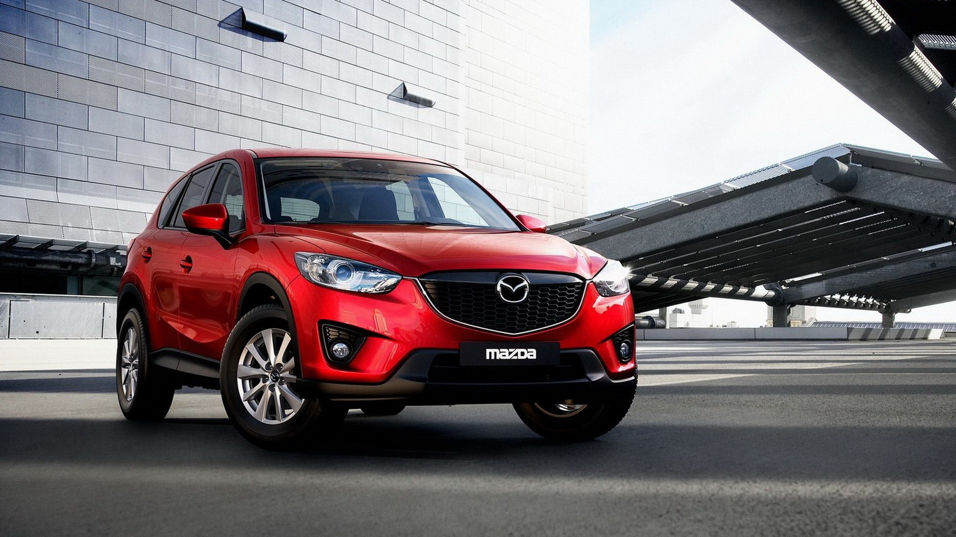 Red Mazda CX-5 parked outdoors HD Wallpaper