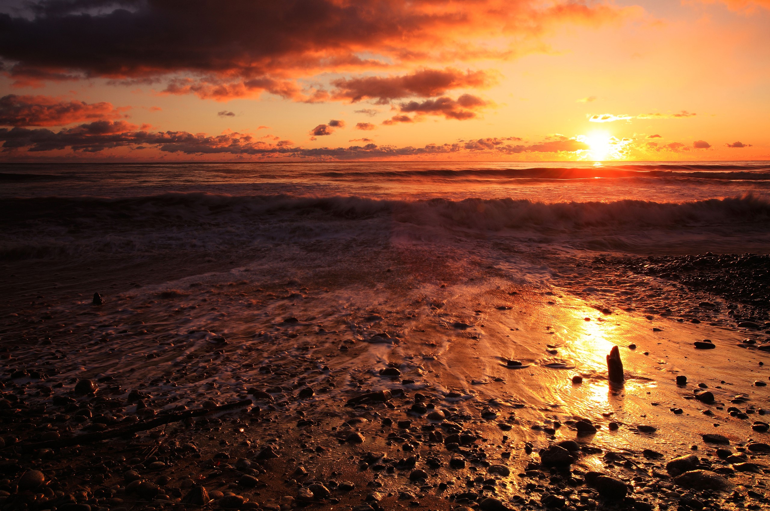 Sunset over the ocean with dramatic clouds HD Wallpaper
